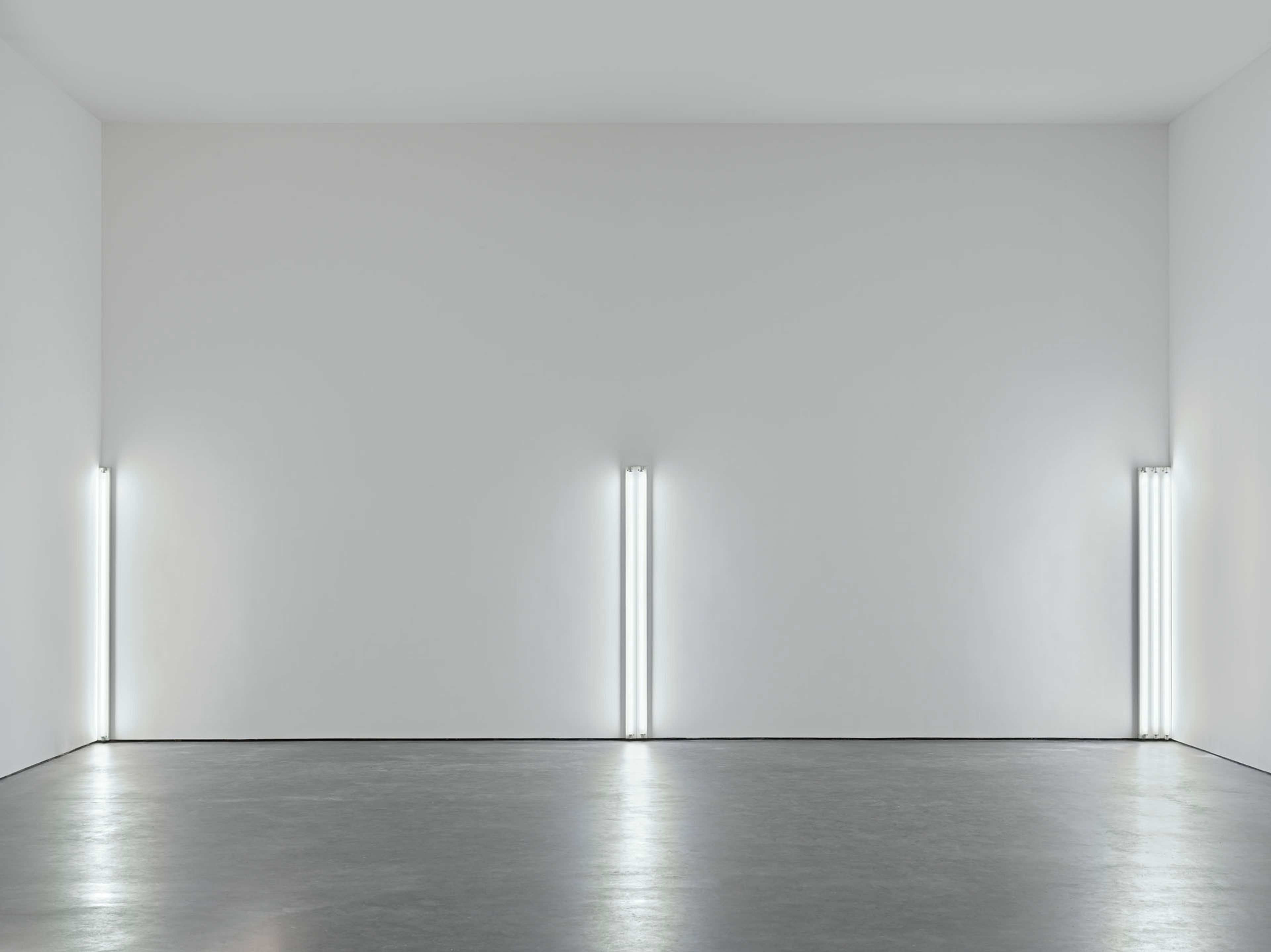 A sculpture in daylight fluorescent light by Dan Flavin, titled the nominal three (to William of Ockham), dated 1963.