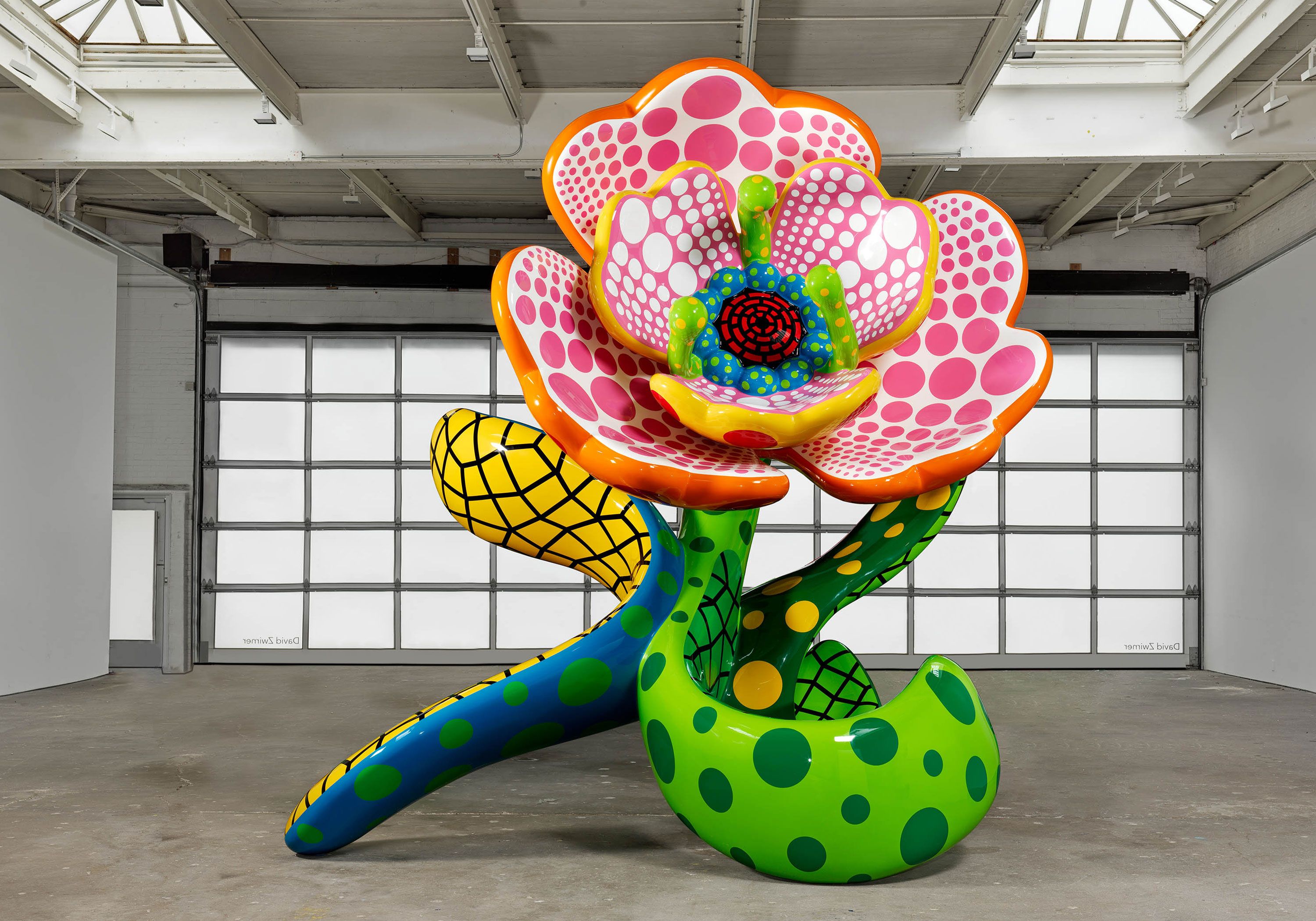 A sculpture by Yayoi Kusama, titled I Spend Each Day Embracing Flowers, dated 2023.