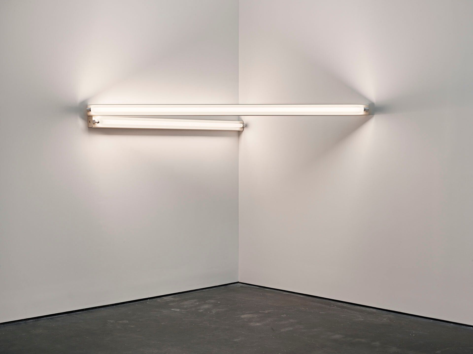 An untitled sculpture by Dan Flavin, composed of col white fluorescent light, dated 1966.