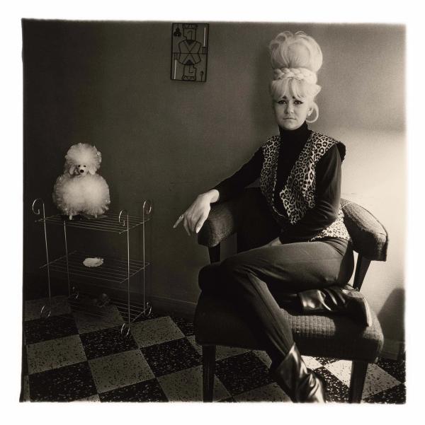 Diane Arbus — Lady bartender at home with souvenir dog, New Orleans, La., 1964