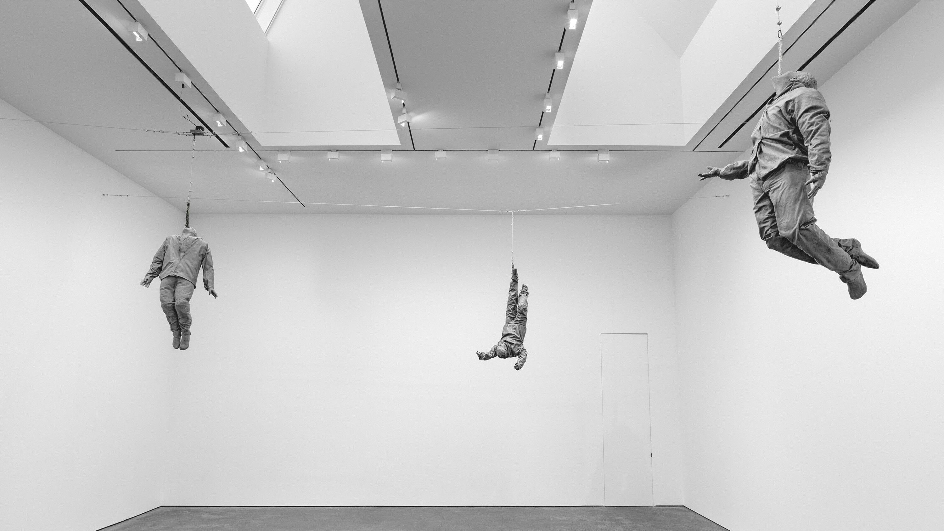 An installation view of the works Hanging Figures featured in the exhibition titled Juan Muñoz: Seven Rooms, David Zwirner, New York, dated 2022