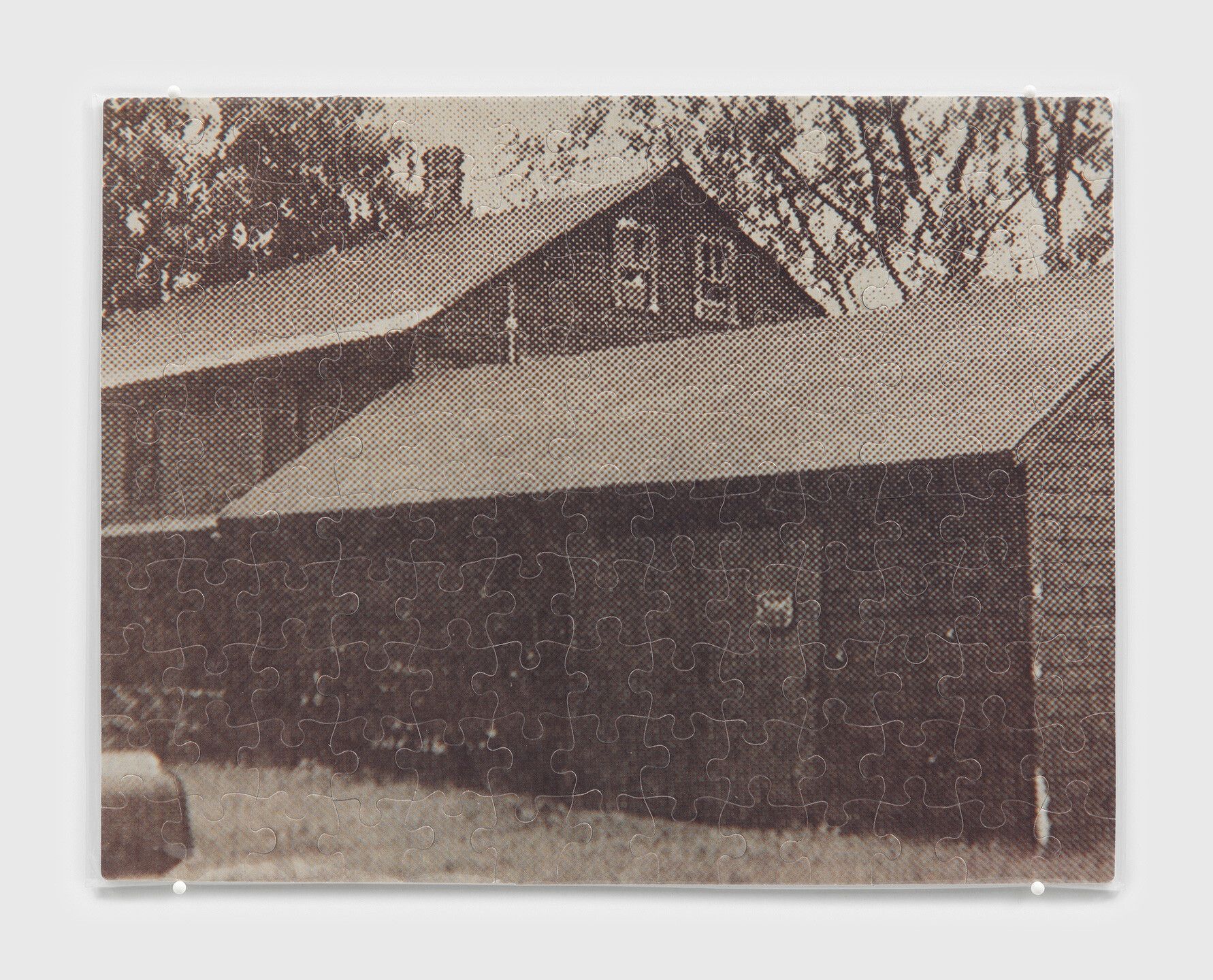 A c-print jigsaw puzzle in plastic bag by Felix Gonzalez-Torres, titled "Untitled" (David Souter's Home), dated 1991.