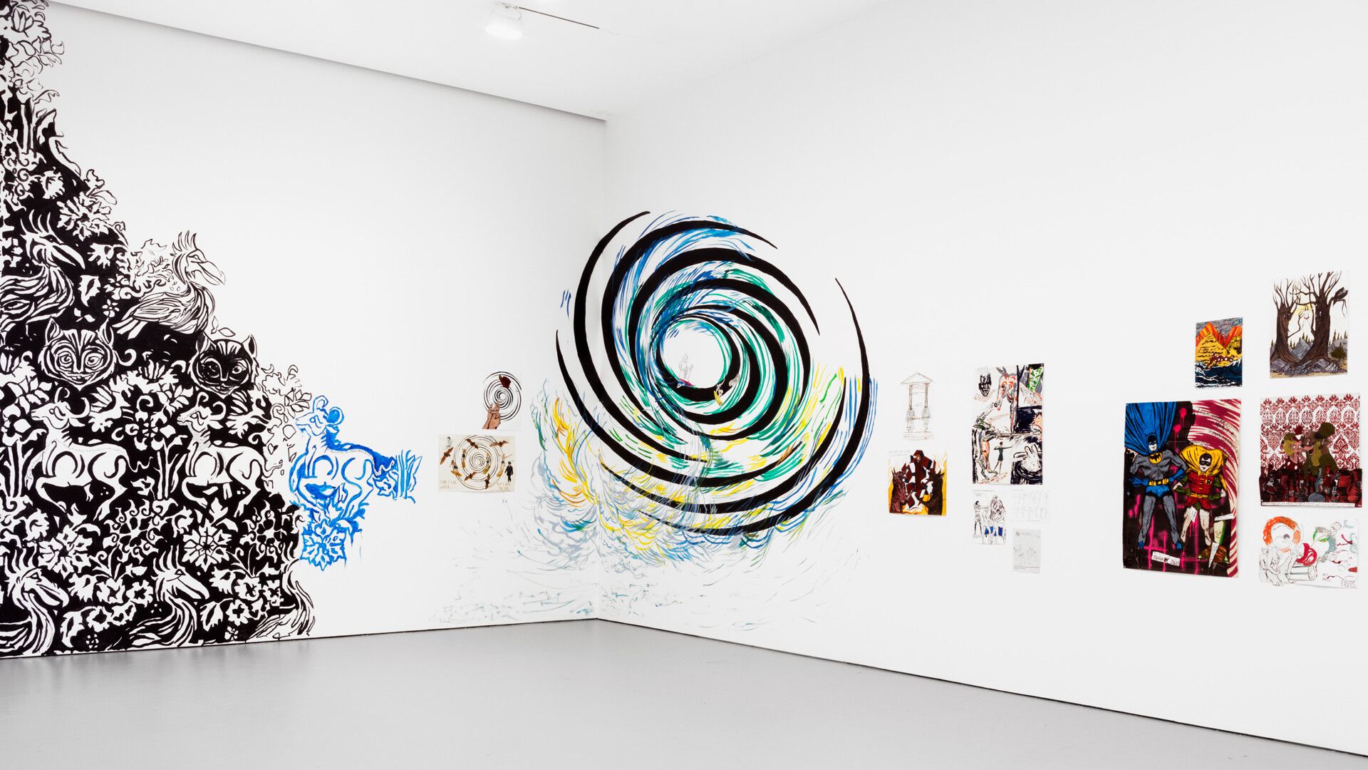 An installation view featuring collaborative works by Marcel Dzama and Raymond Pettibon, dated 2016