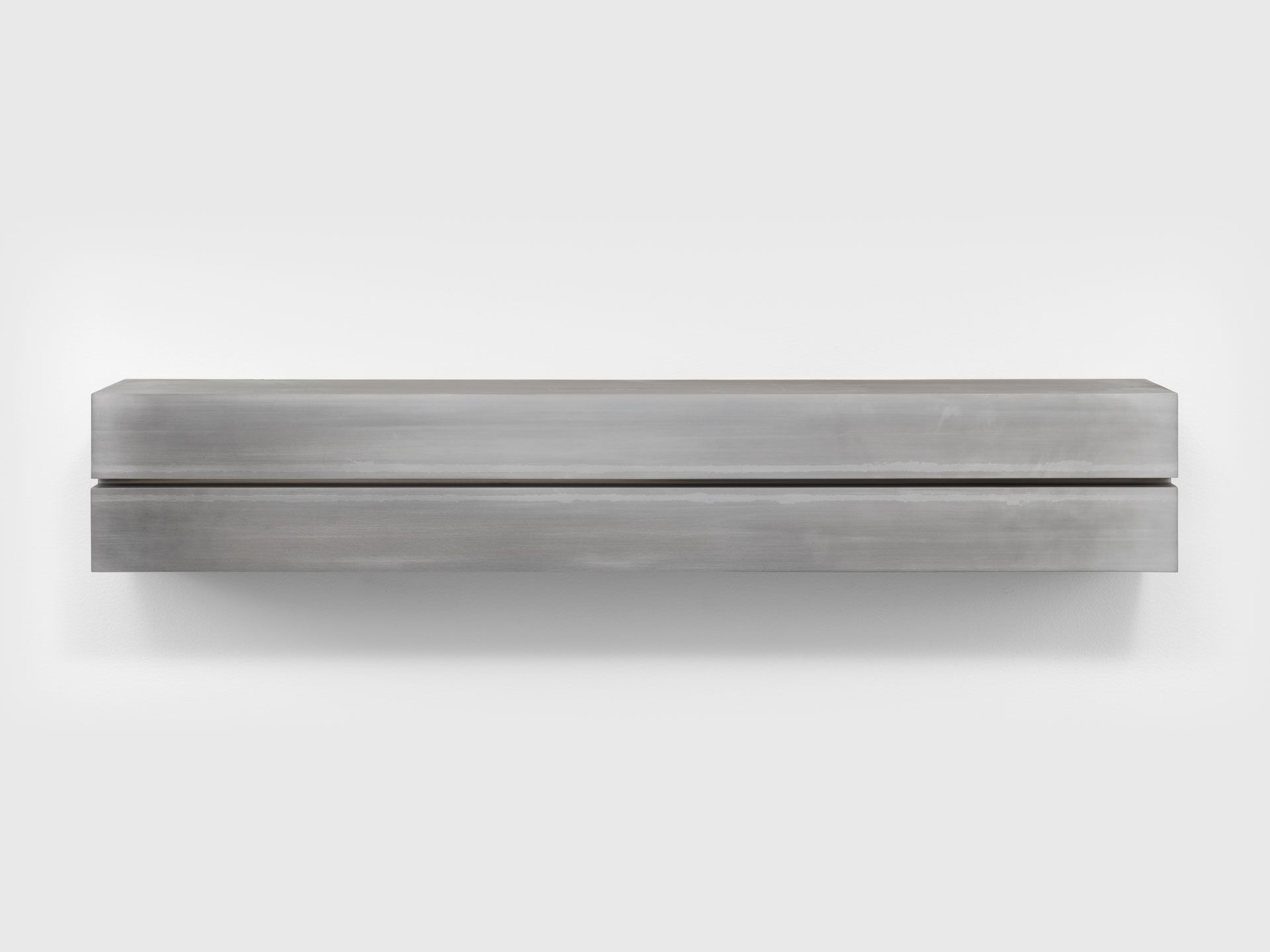 An untitled mill aluminum sculpture by Donald Judd, dated 1984.