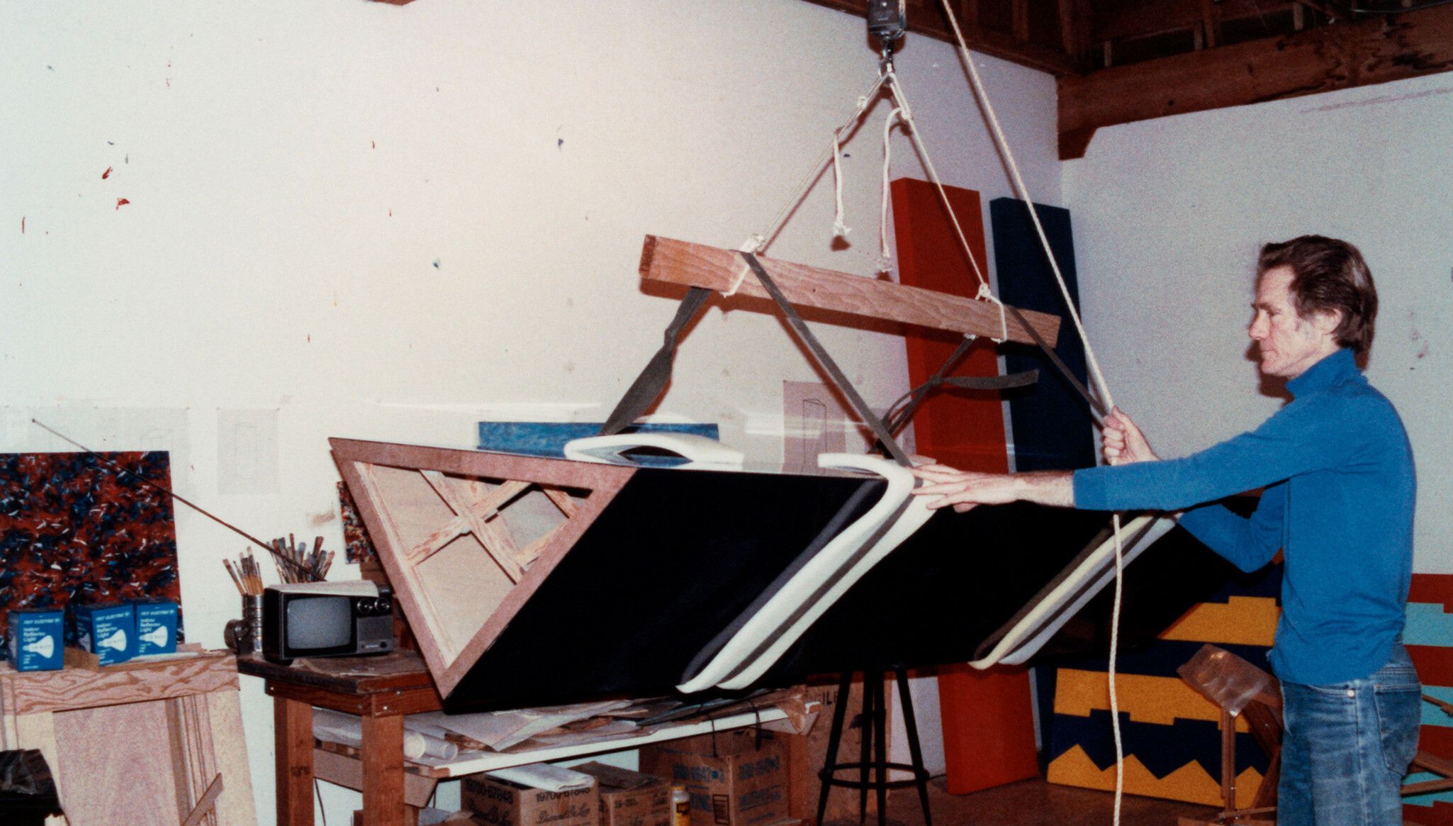 A photograph of John Mccracken in the studio