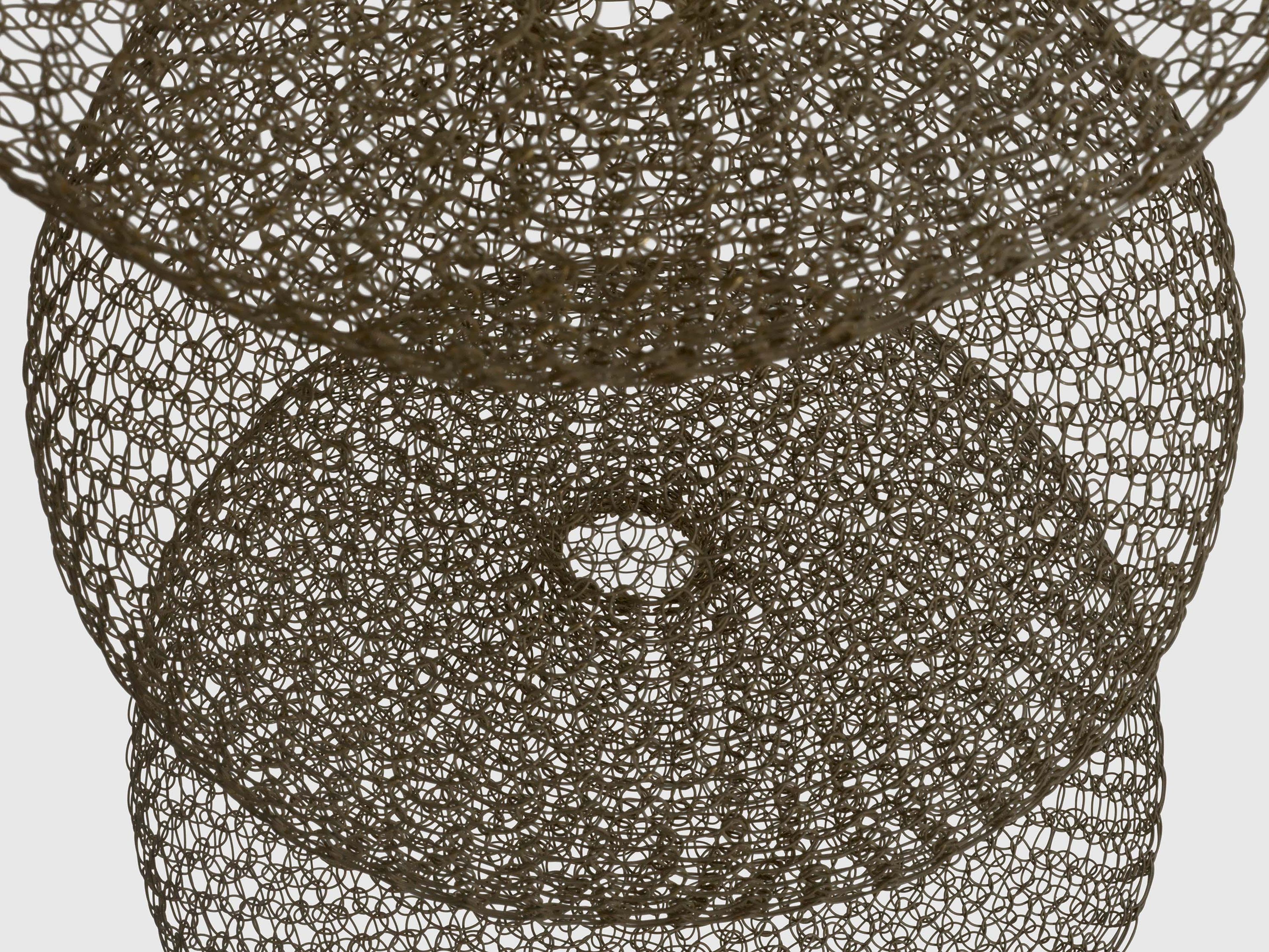 A detail from a sculpture by Ruth Asawa, called Untitled (S.278, Hanging Nine-Lobed, Single-Layered Continuous Form), dated circa 1955.