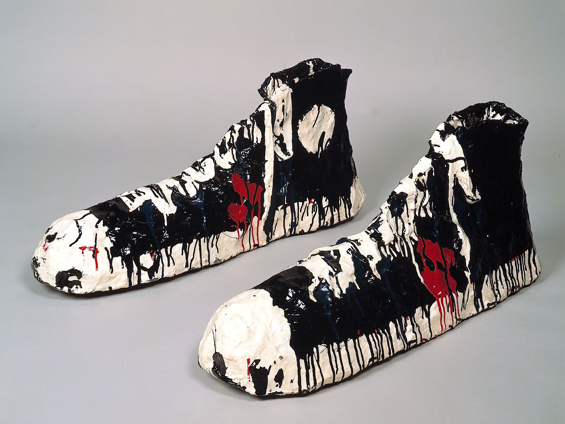 A sculpture by Claes Oldenburg, titled Giant Gym Shoes, dated 1963.
