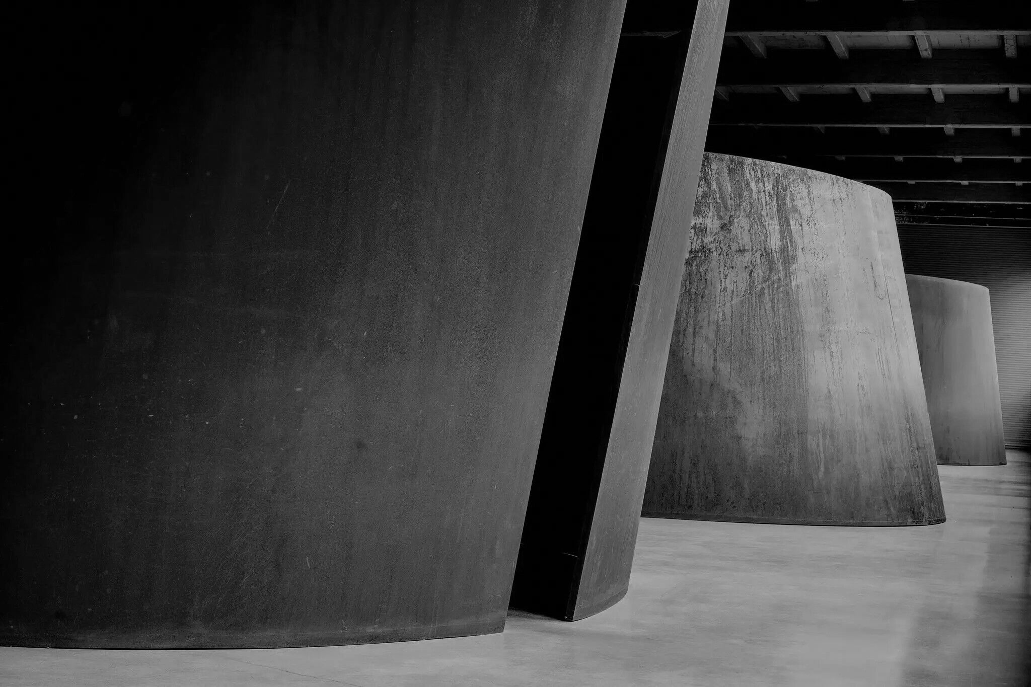 Three of Richard Serra’s “Torqued Ellipses,” from 1996-97, now on permanent view at the Dia Art Foundation in Beacon, N.Y. The curving steel plates have oxidized since their debut from vermilion to dark brown