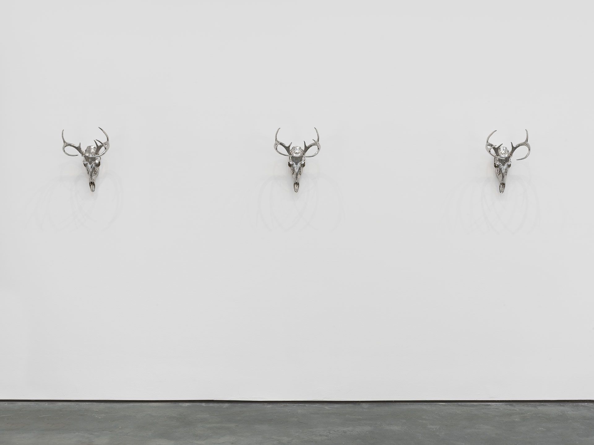 A set of sculptures by Sherrie Levine, titled Nickel Plated Antelope Skulls: Suite of Three, dated 2017.