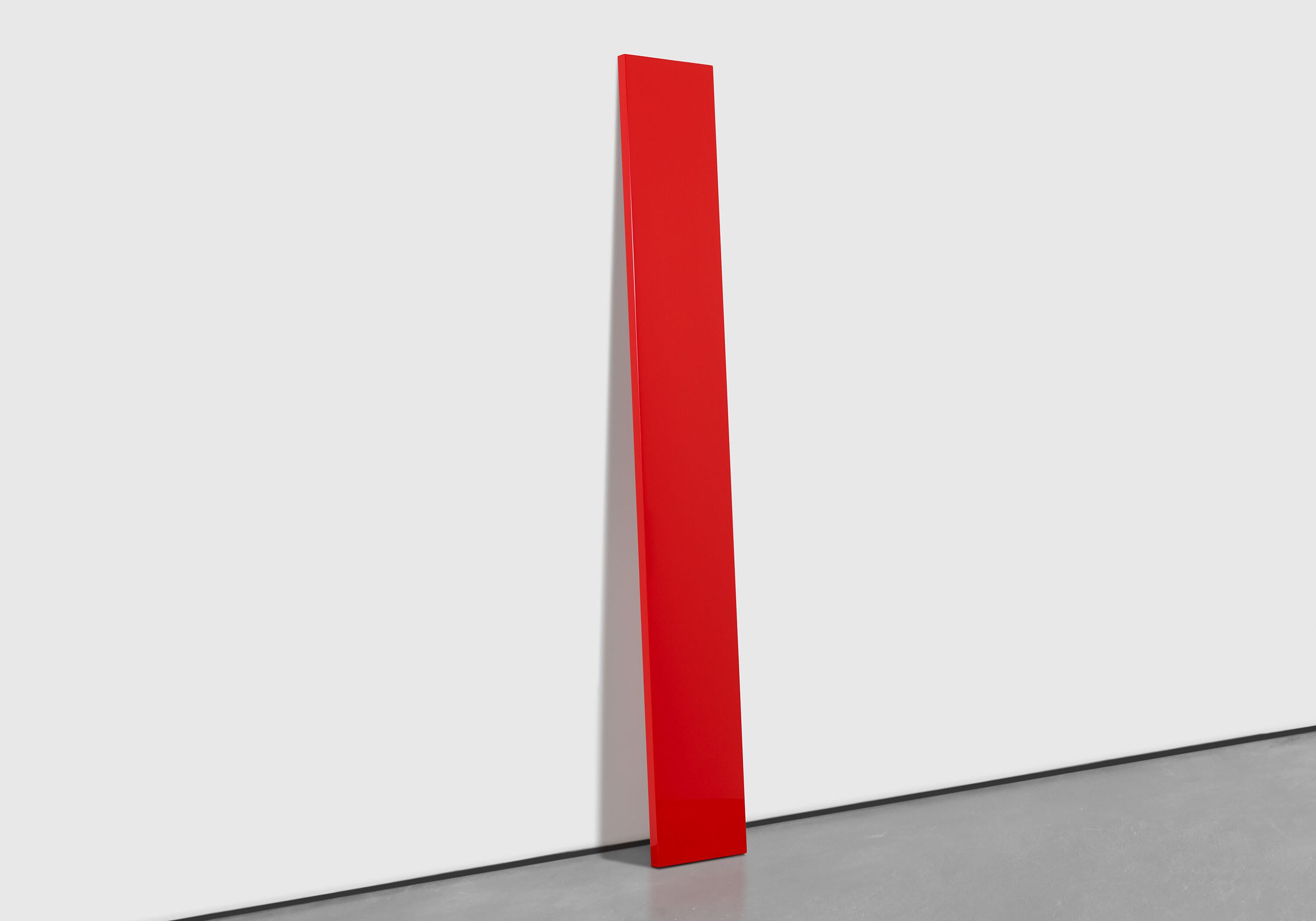 A sculpture by John McCracken, titled Untitled (Red Plank), dated 1976.
