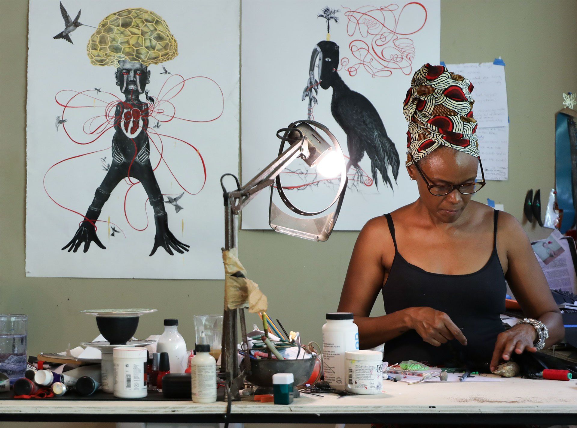 A photograph of Jamine Thomas-Girvan in her studio in Trinidad and Tobago, dated 2019.