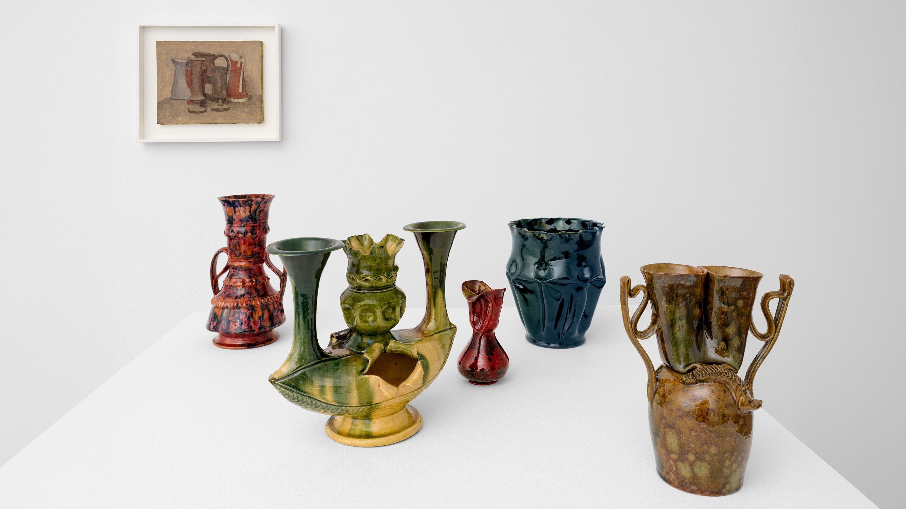 Install image of works by George Ohr and Giorgio Morandi for TEFAF 2024.