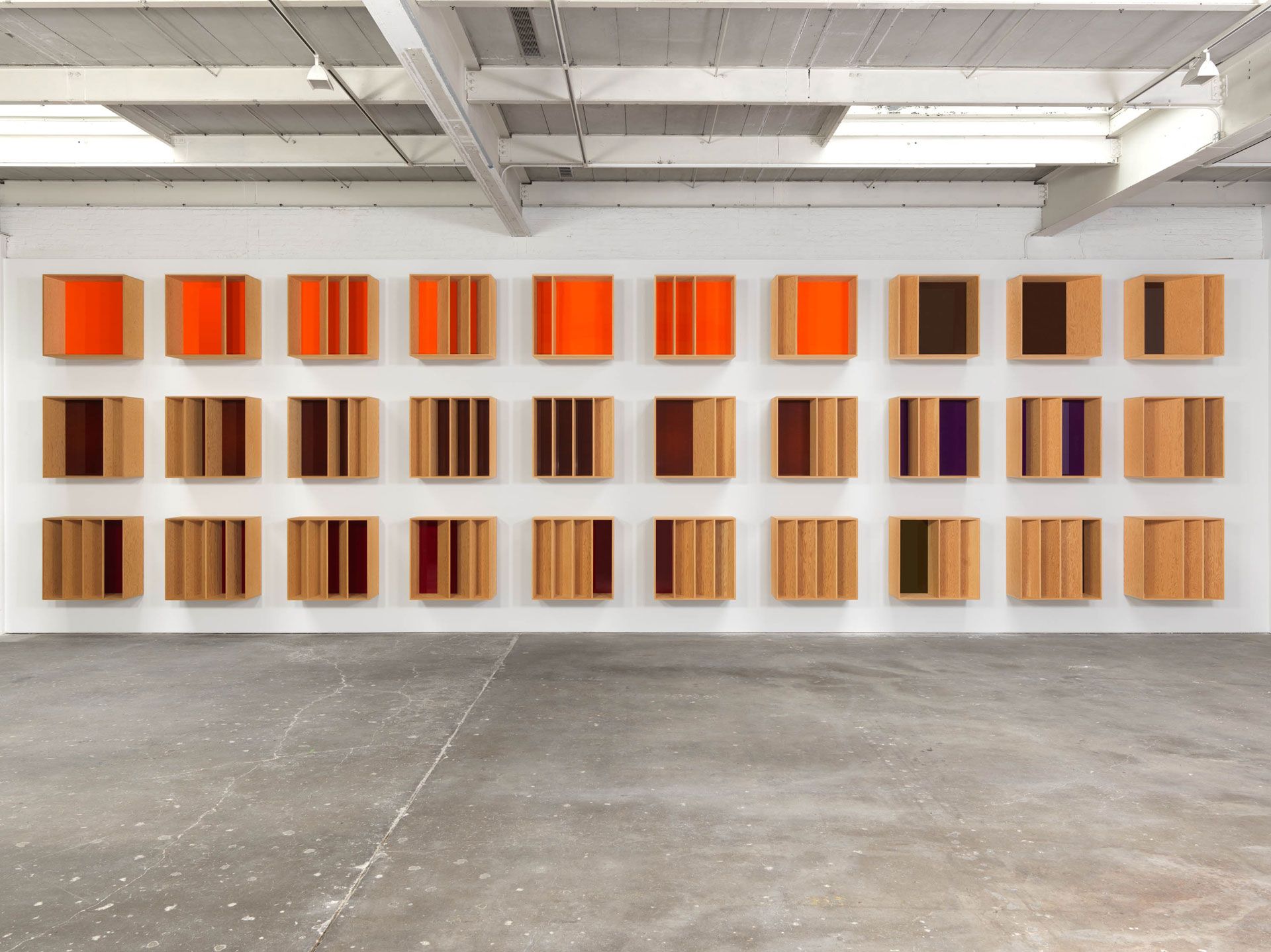 An untitled douglas fir plywood and acrylic sheets comprised of thirty units by Donald Judd, dated 1986.