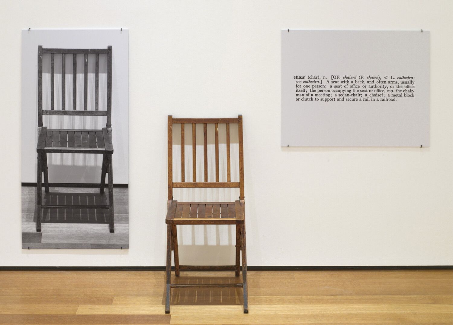 A photo of Josef Kosuth's One and Three Chairs, made in 1965.