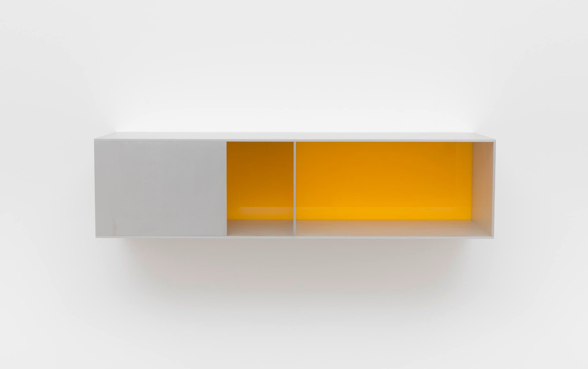 An untitled anodized aluminum and clear and yellow acrylic sheet sculpture by Donald Judd, dated 1991.
