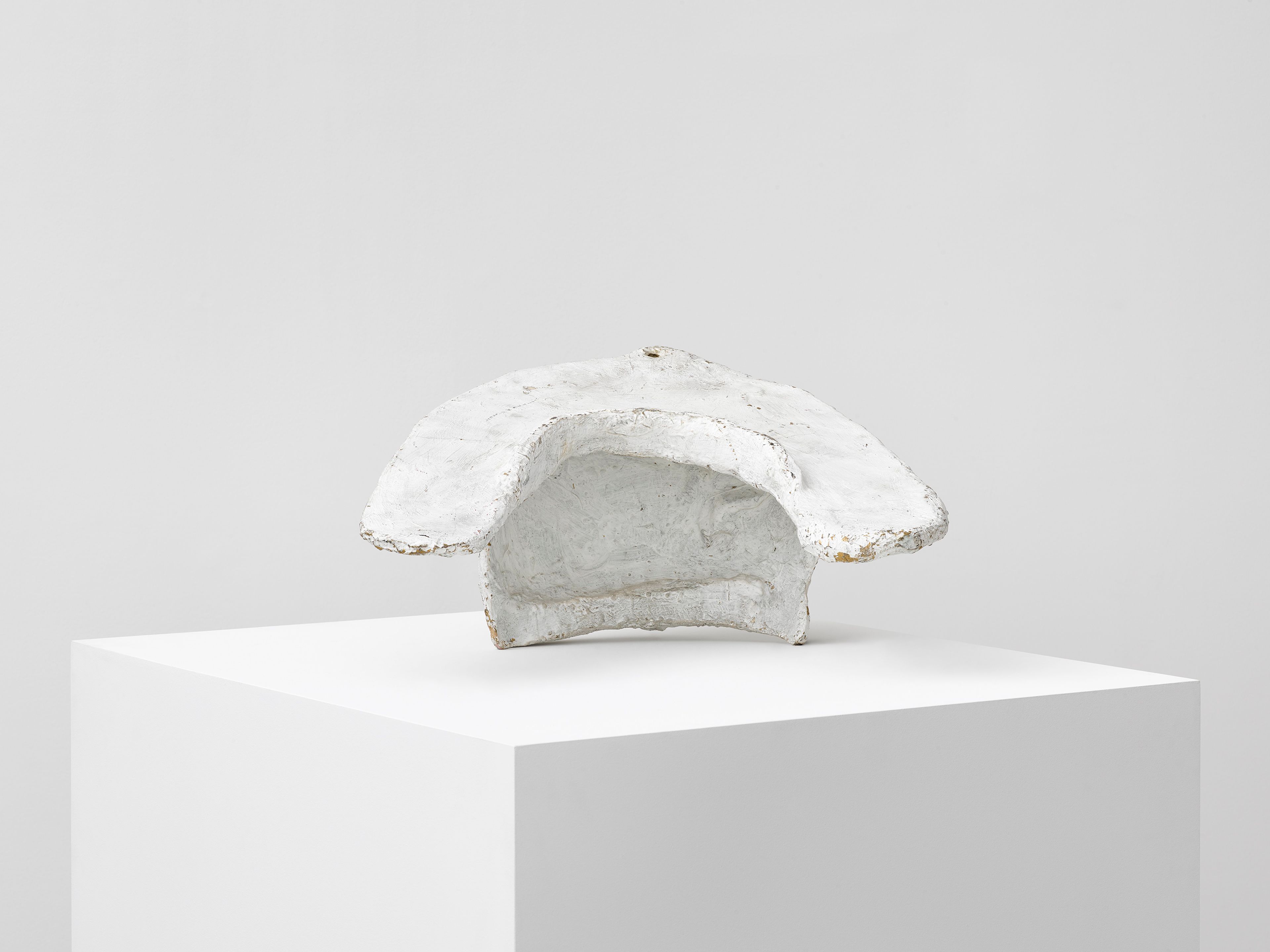 A papier-mâché, plaster, and dispersion sculpture by Franz West, titled Passstück (Adaptive), dated before 1980.