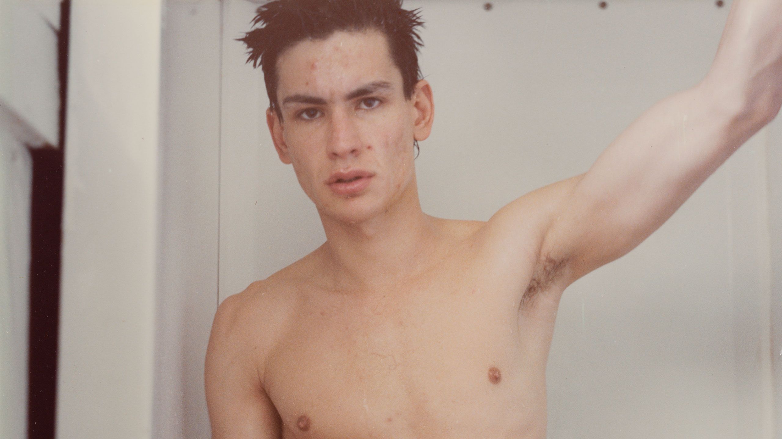 A detail from a photograph by Mark Morrisroe, called Untitled (self-portrait standing in the shower), dated 1991.