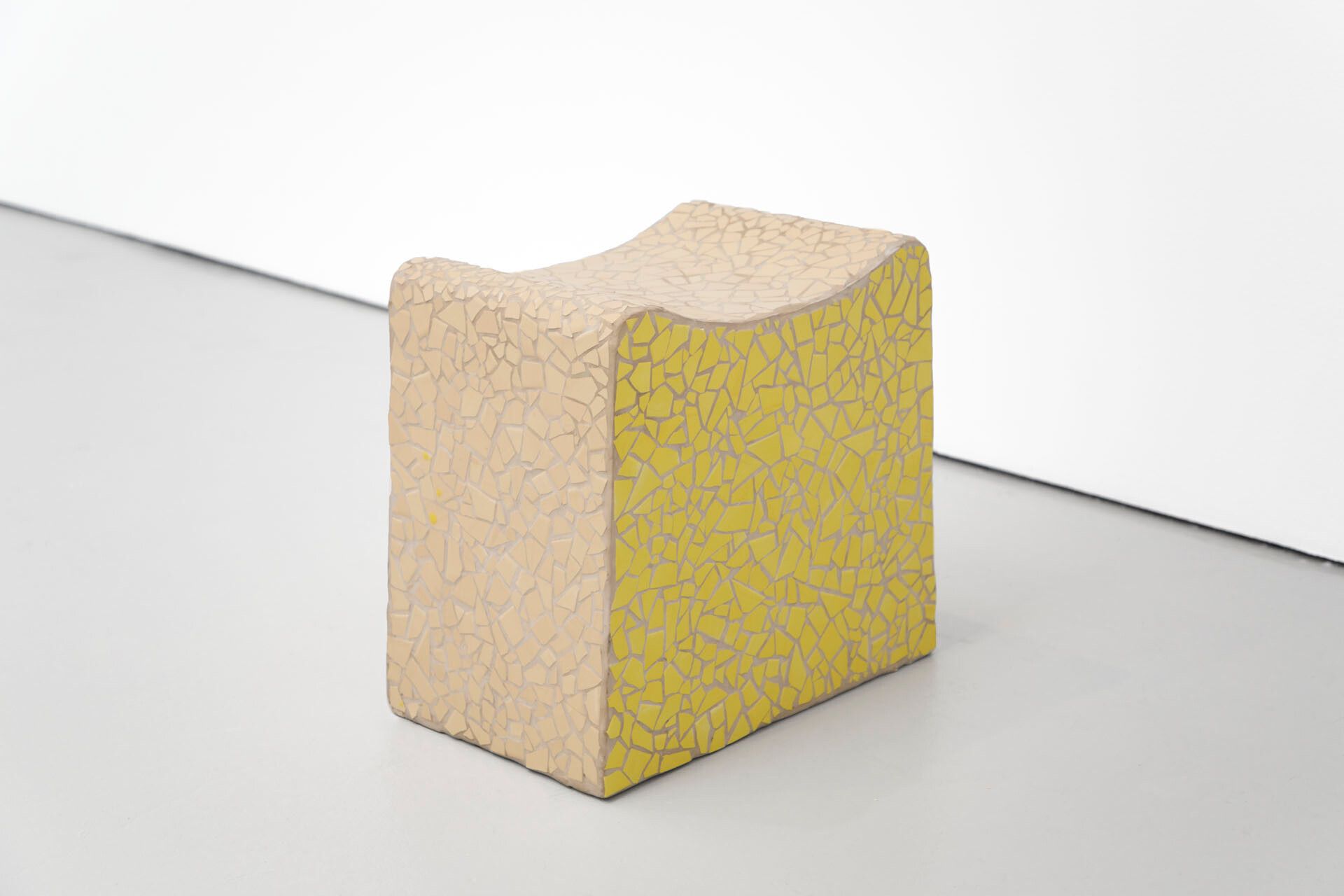 A sculpture by Gordon Hall, titled Seat (Yellow and Beige), dated 2016.