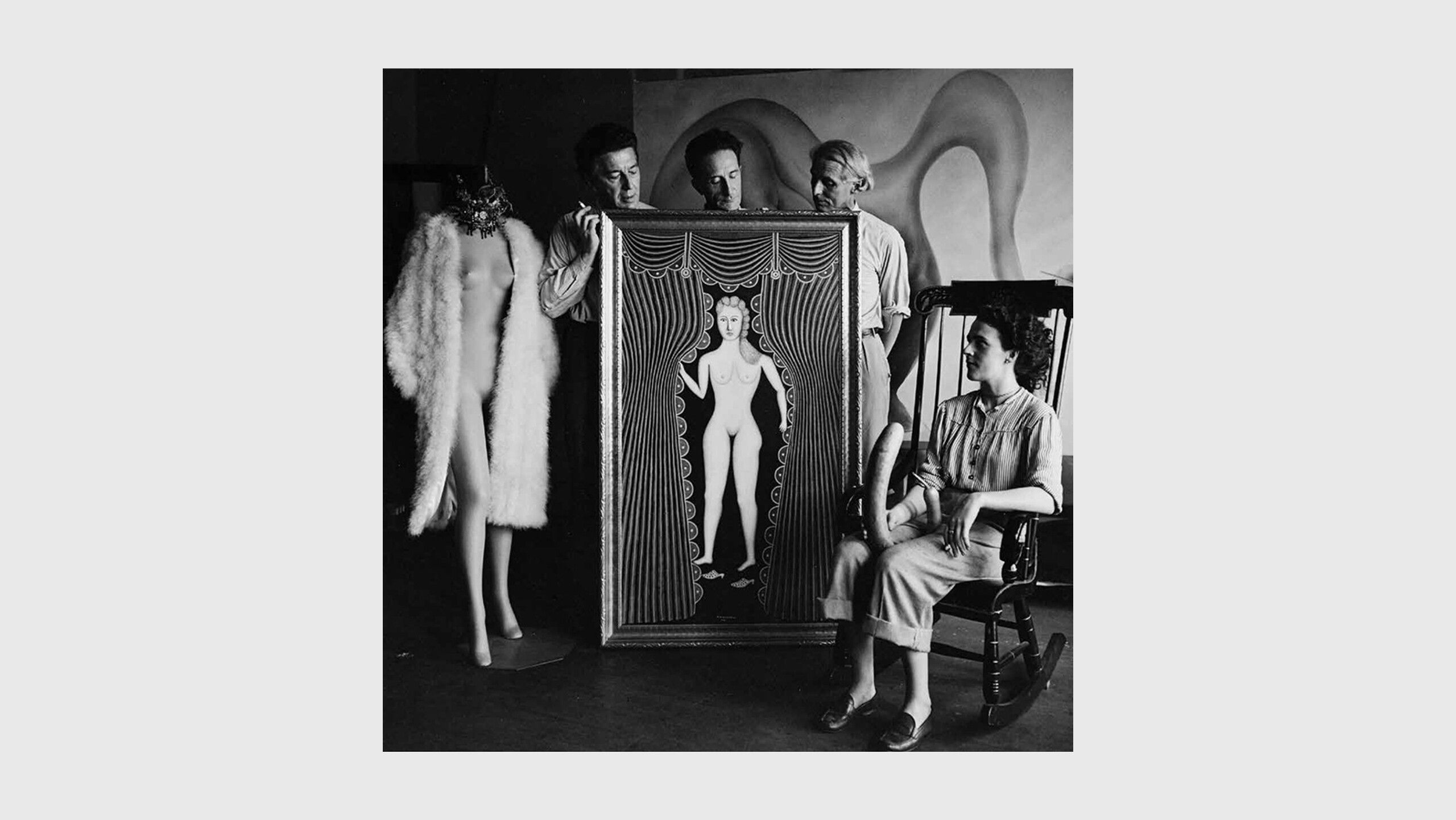 A Photo by Hermann Landshoff, of the painting with Hirshfield and his friends, André Breton, Leonora Carrington, and Marcel Duchamp, in a staged photograph