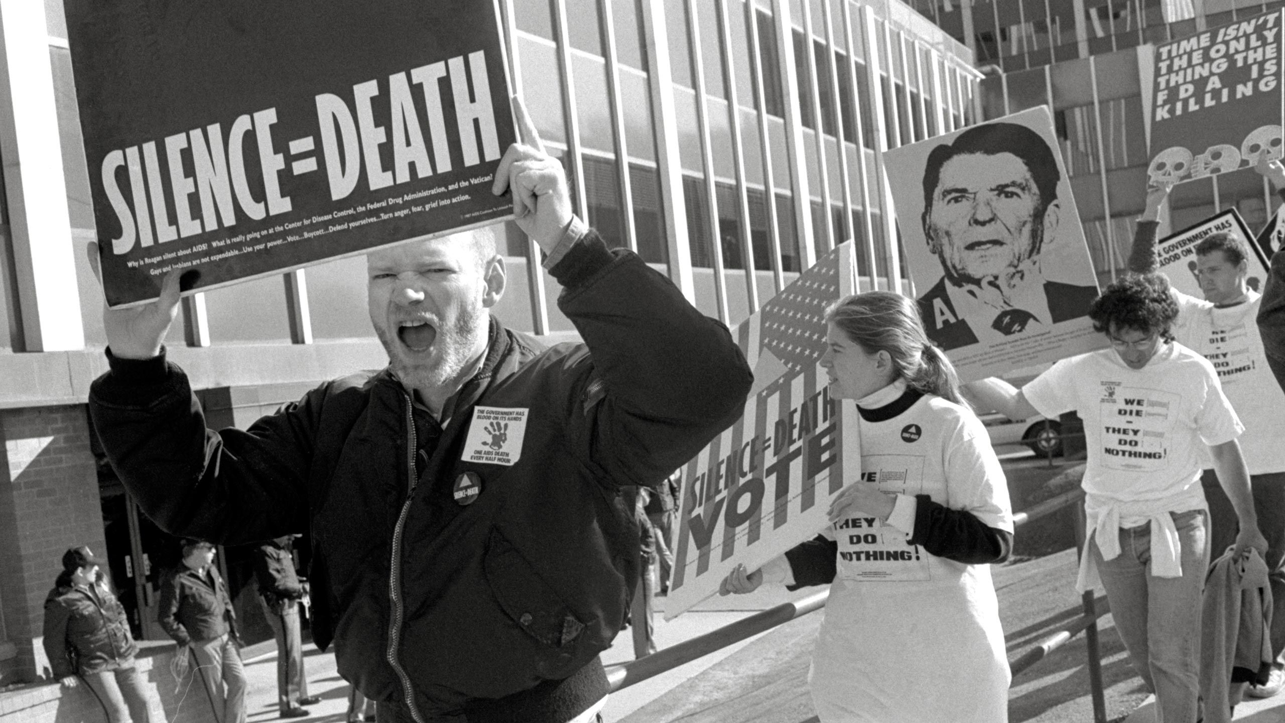 A photo by T.L. Litt of the ACT UP "SEIZE CONTROL OF THE FDA" action at the Food and Drug Administration Headquarters in Rockville, Maryland on October 11, 1988.