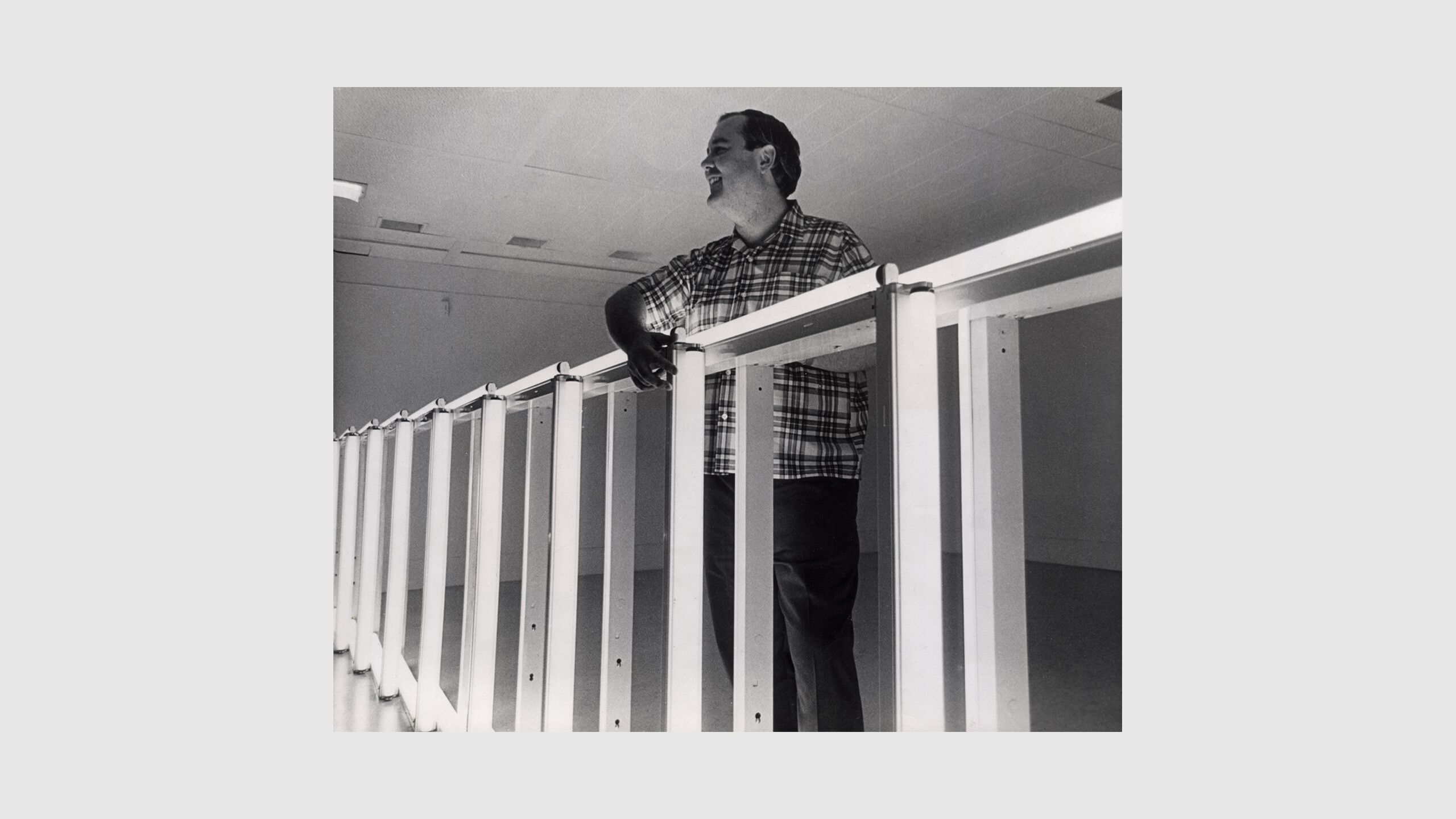 a photo pf Dan Flavin installing his solo exhibition fluorescent light, etc. from Dan Flavin, at the National Gallery of Canada, Ottawa, in 1969.