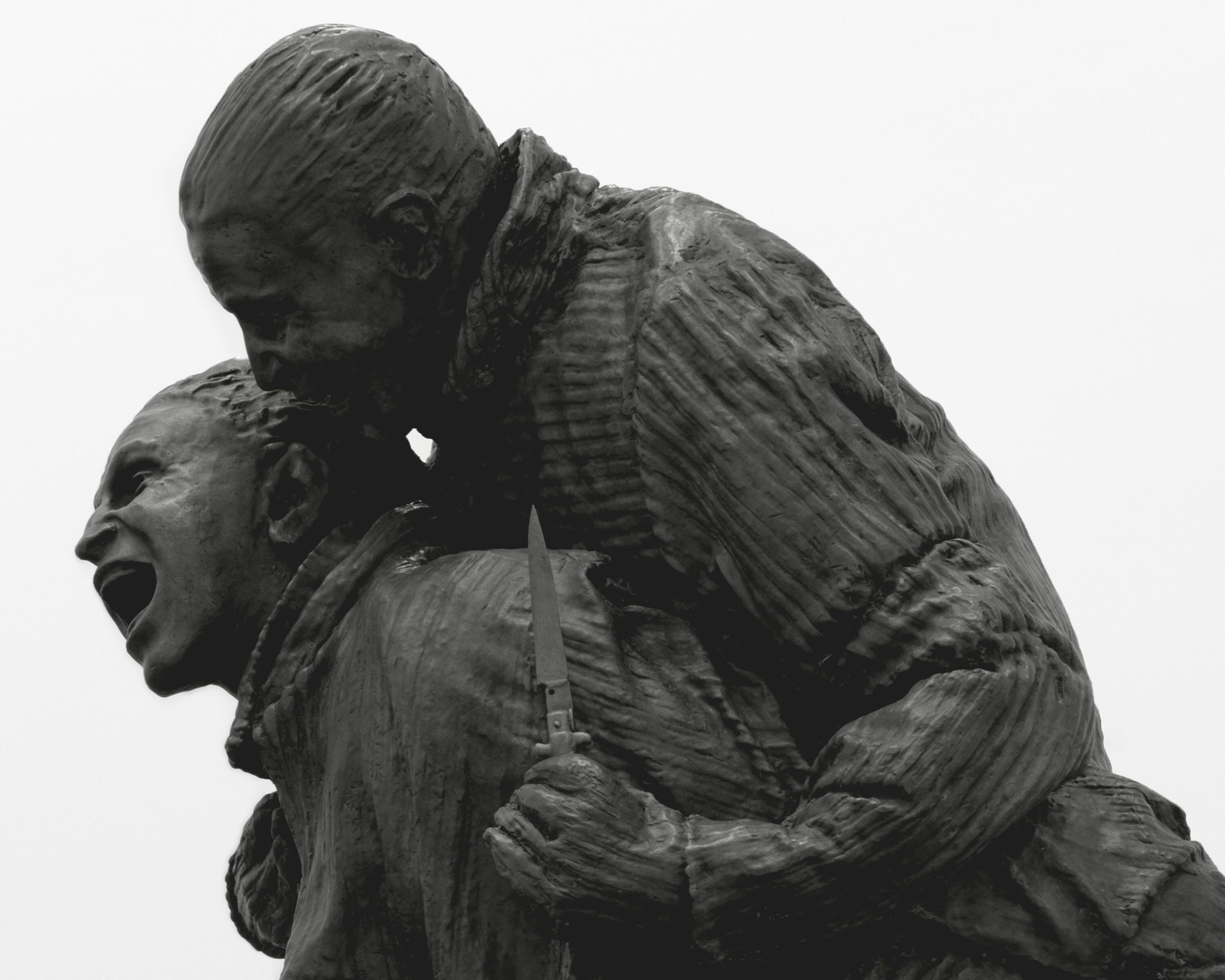 A close-up of one of the sculptures in Four Piggybacks with Knives, dated 2022