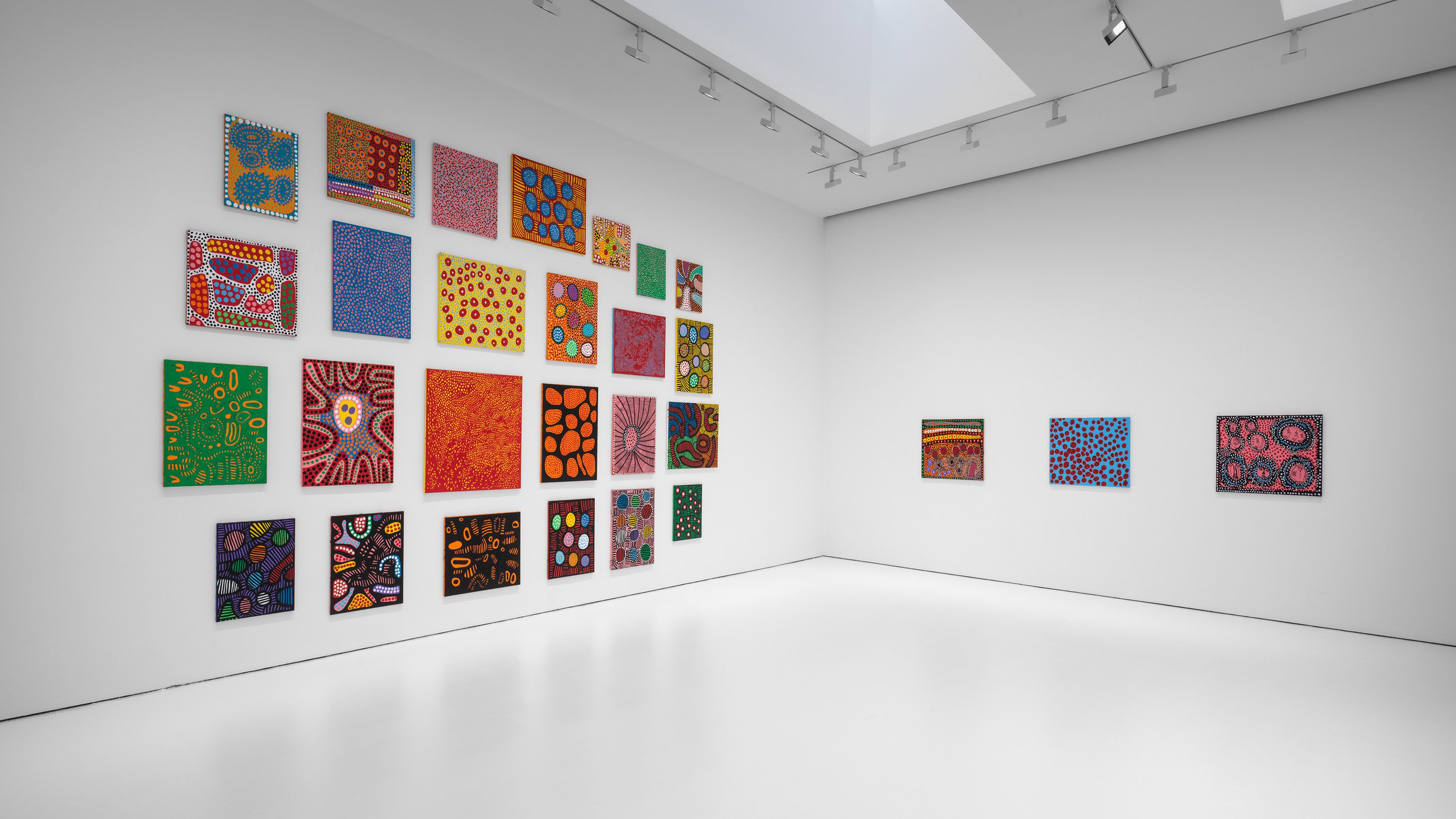 An installation view of the exhibition titled Yayoi Kusama, I Spend Each Day Embracing Flowers, dated 2023