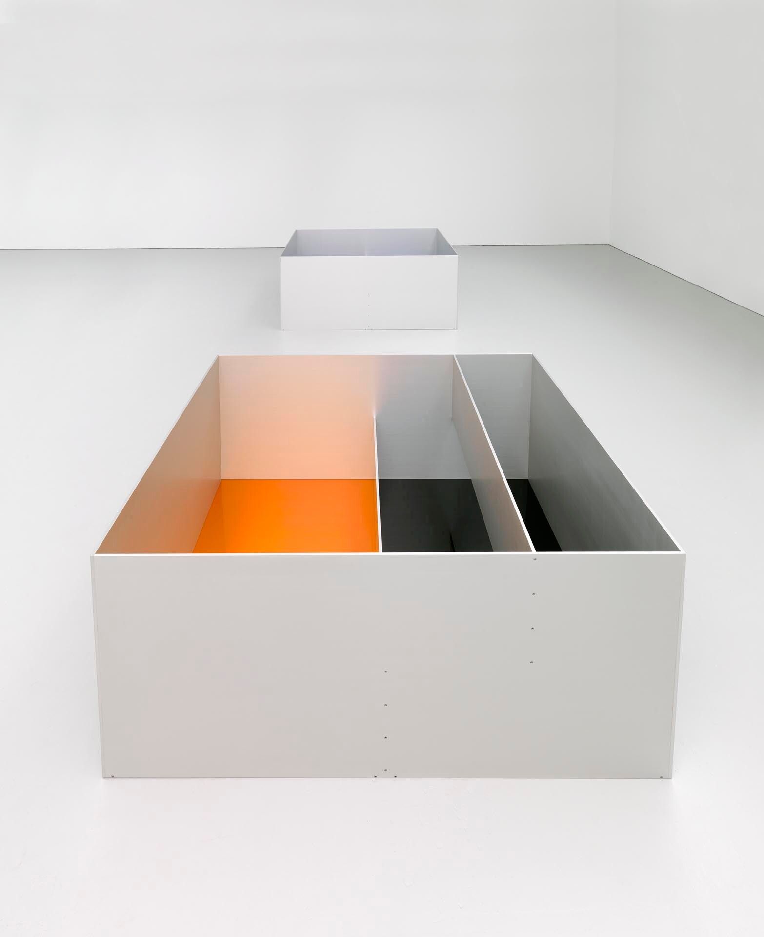 An untitled anodized aluminum with clear, amber and black acrylic sheets sculpture by Donald Judd, dated 1989.
