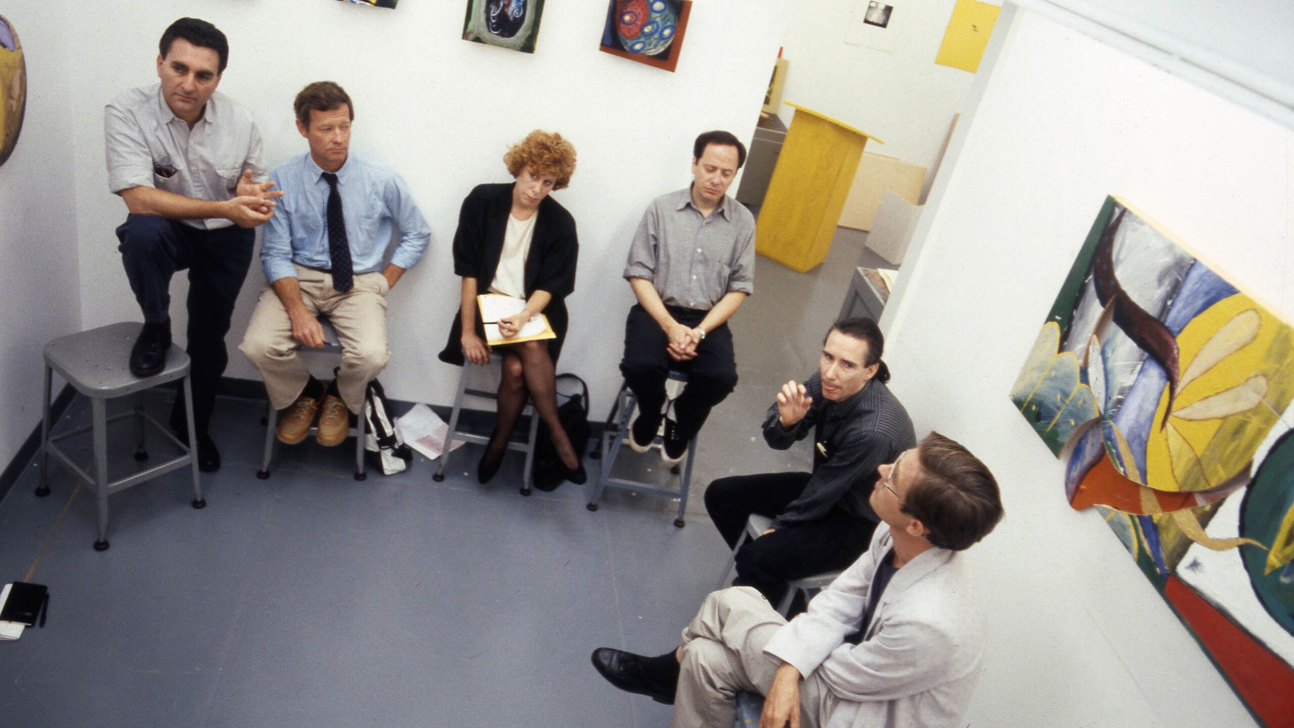 A photo of Laurence Dreiband, Richard Hertz, Sabrina Ott, Stephen Prina, Mike Kelley, Jeremy Gilbert-Rolfe, and student Steve Roden at ArtCenter, dated 1989.