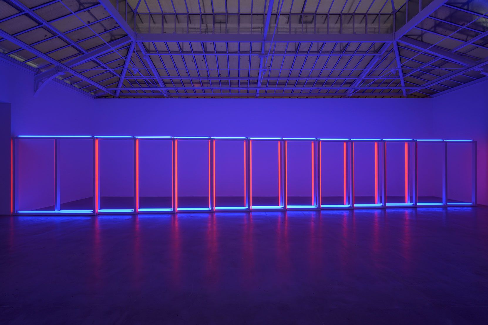 An untitled blue and red fluorescent light sculpture by Dan Flavin, dated 1970.