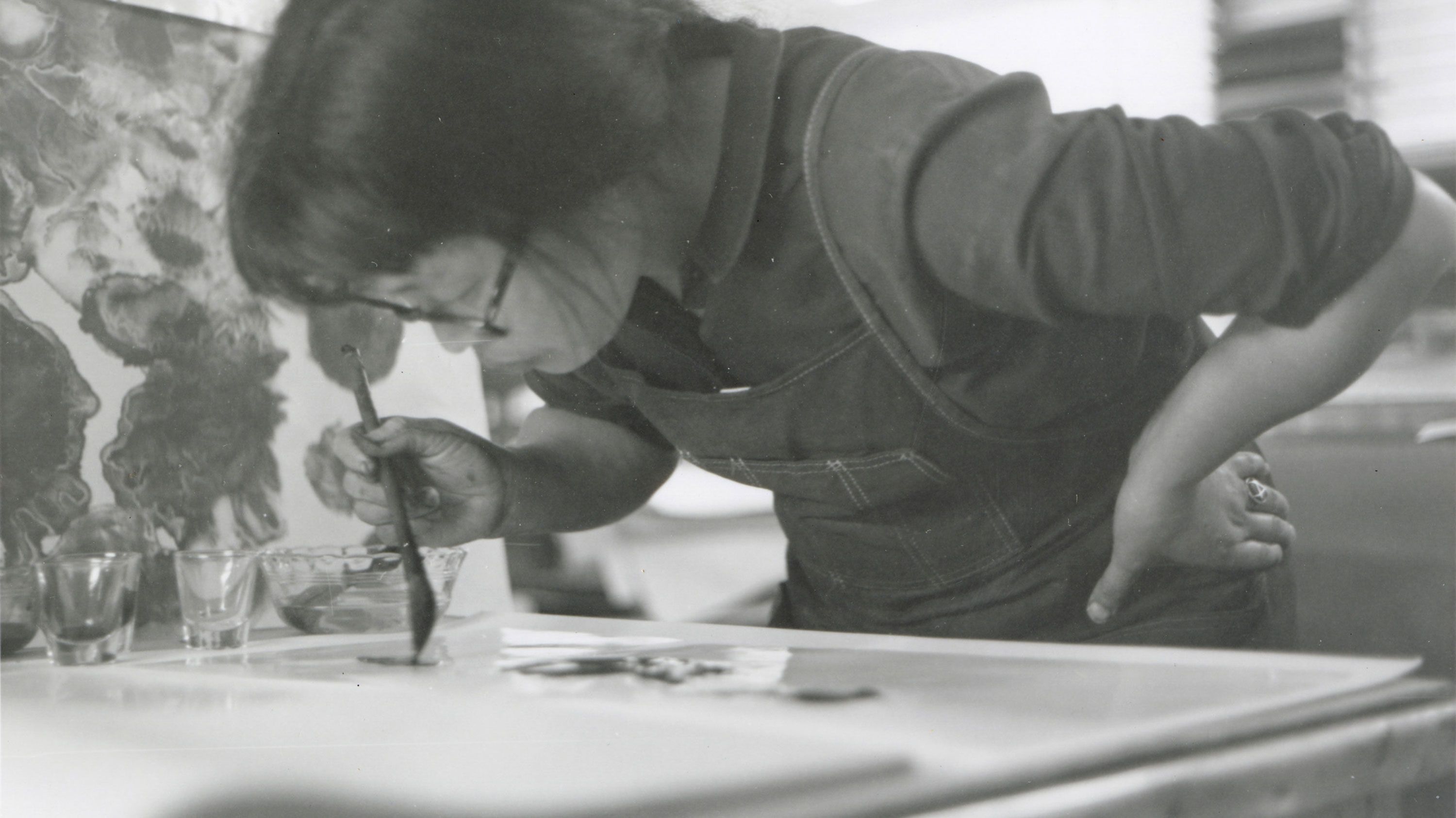 Ruth Asawa painting at the Tamarind Lithography Workshop.