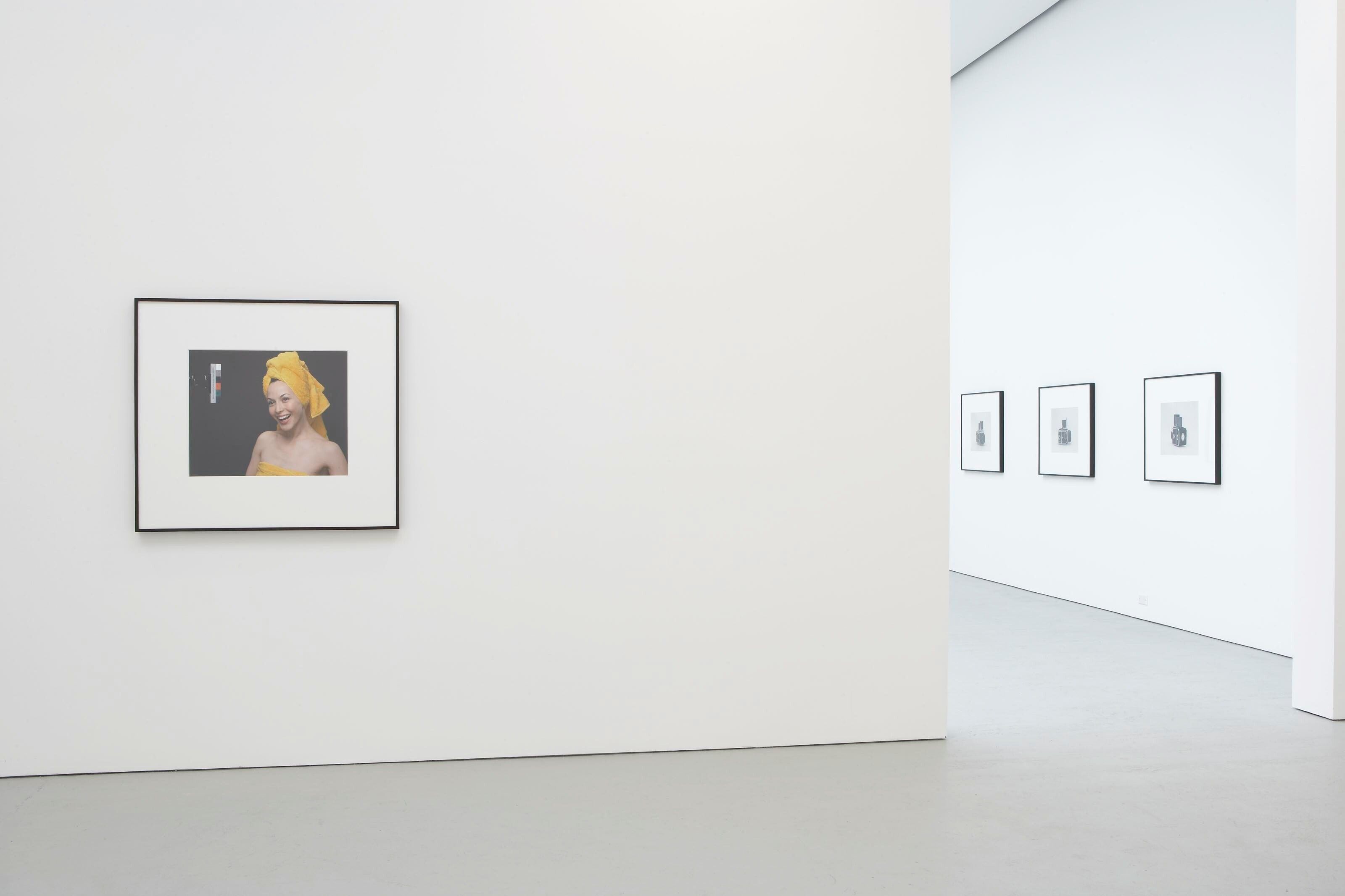 Installation view of the exhibition Christopher Williams: For Example: Dix-Huit Leçons Sur La Société Industrielle (Revision 4), at David Zwirner in New York, dated 2006.