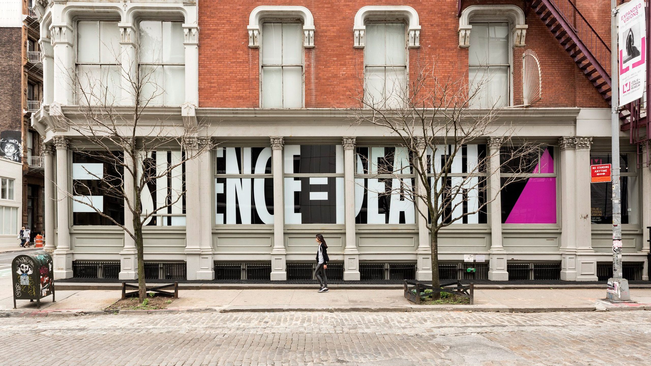 A photo of the Silence=Death slogan in the window of the Leslie-Lohman Museum in 2017.