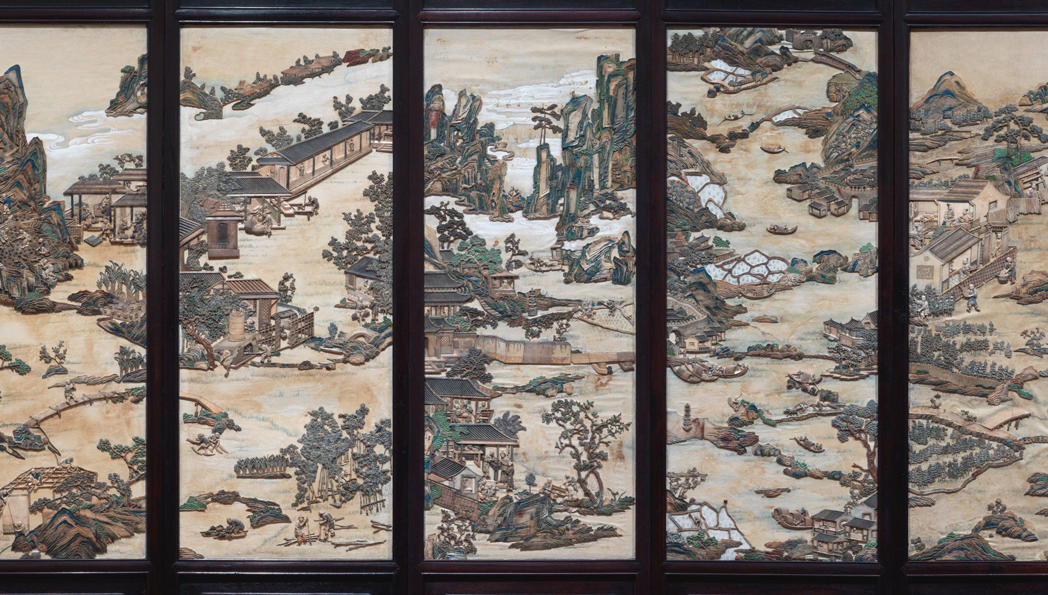 A detail of a Chinese folding screen with figures in a landscape, nineteenth century