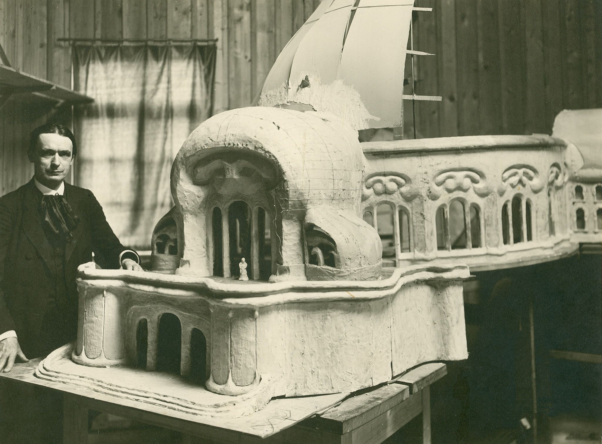 A photo of Rudolf Steiner with a model of the First Goetheanum, Dornach, 1914.