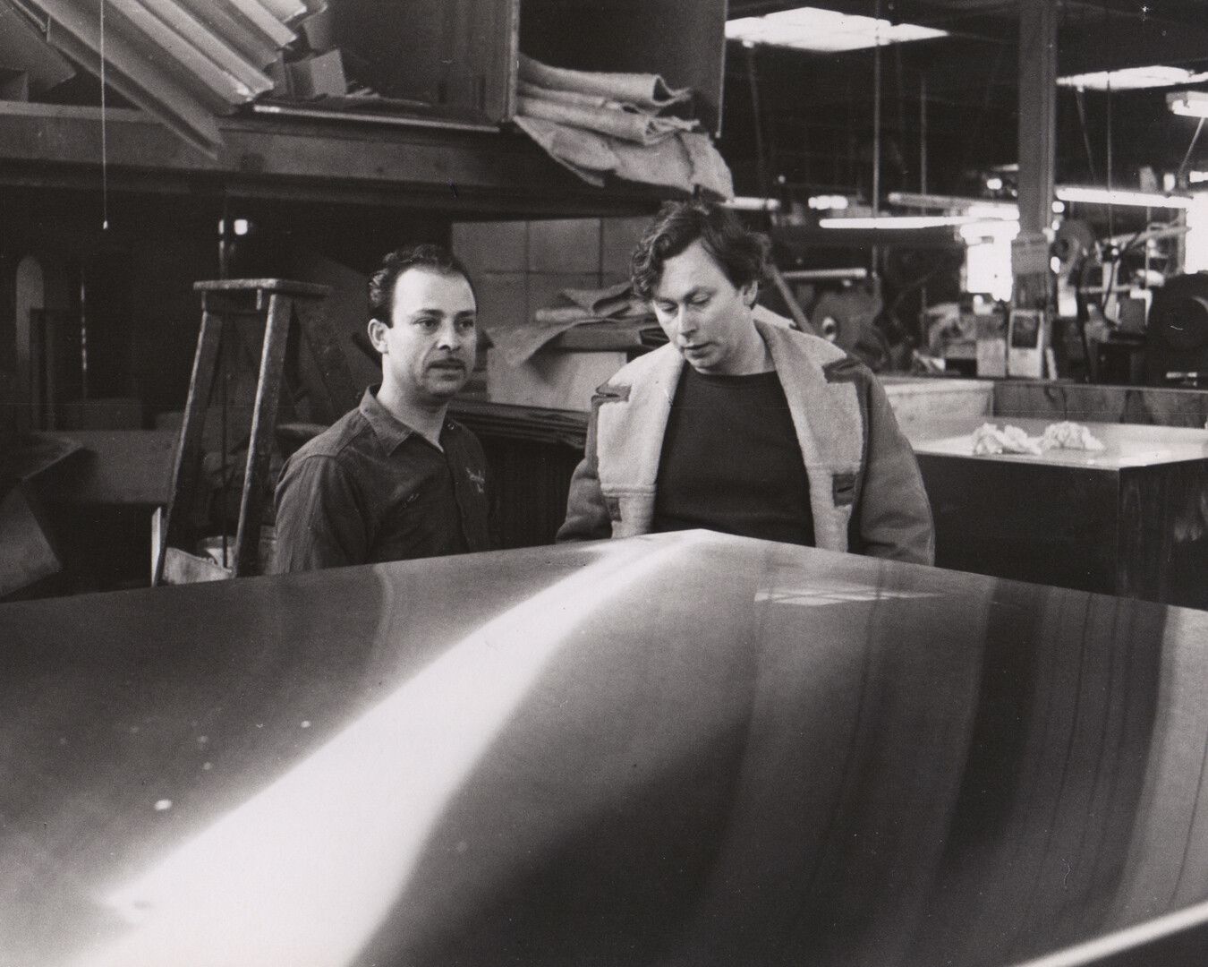 A photograph of José Otero and Donald Judd at Bernstein Brothers, Inc., New York, dated 1968.