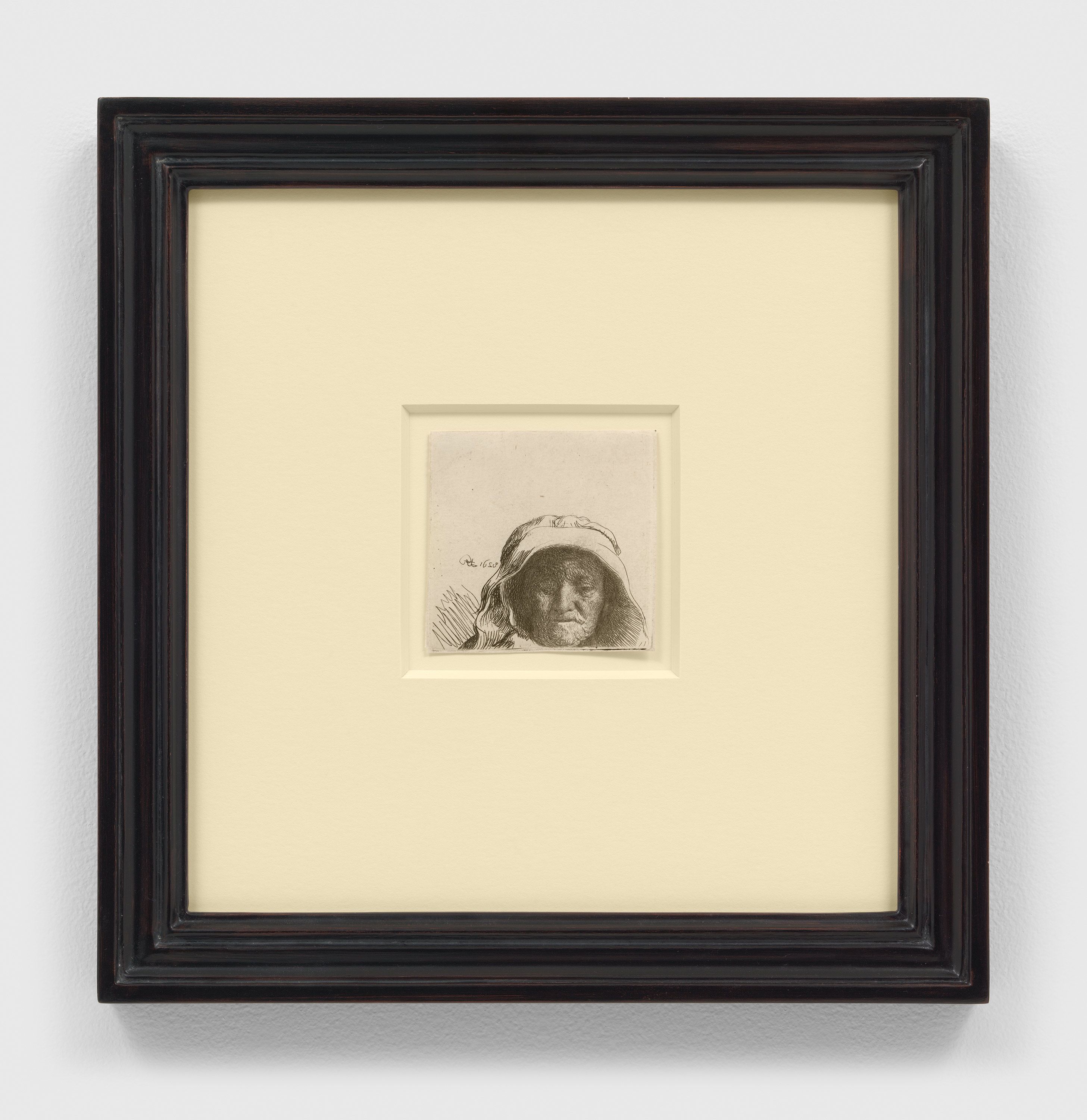 An etching on paper artwork by Rembrandt van Rijn, titled The Artist's Mother: Head Only, Full Face, dated 1628.