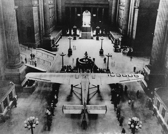 An archival photograph of a trimotor airplane inside Penn Station, dated 1929