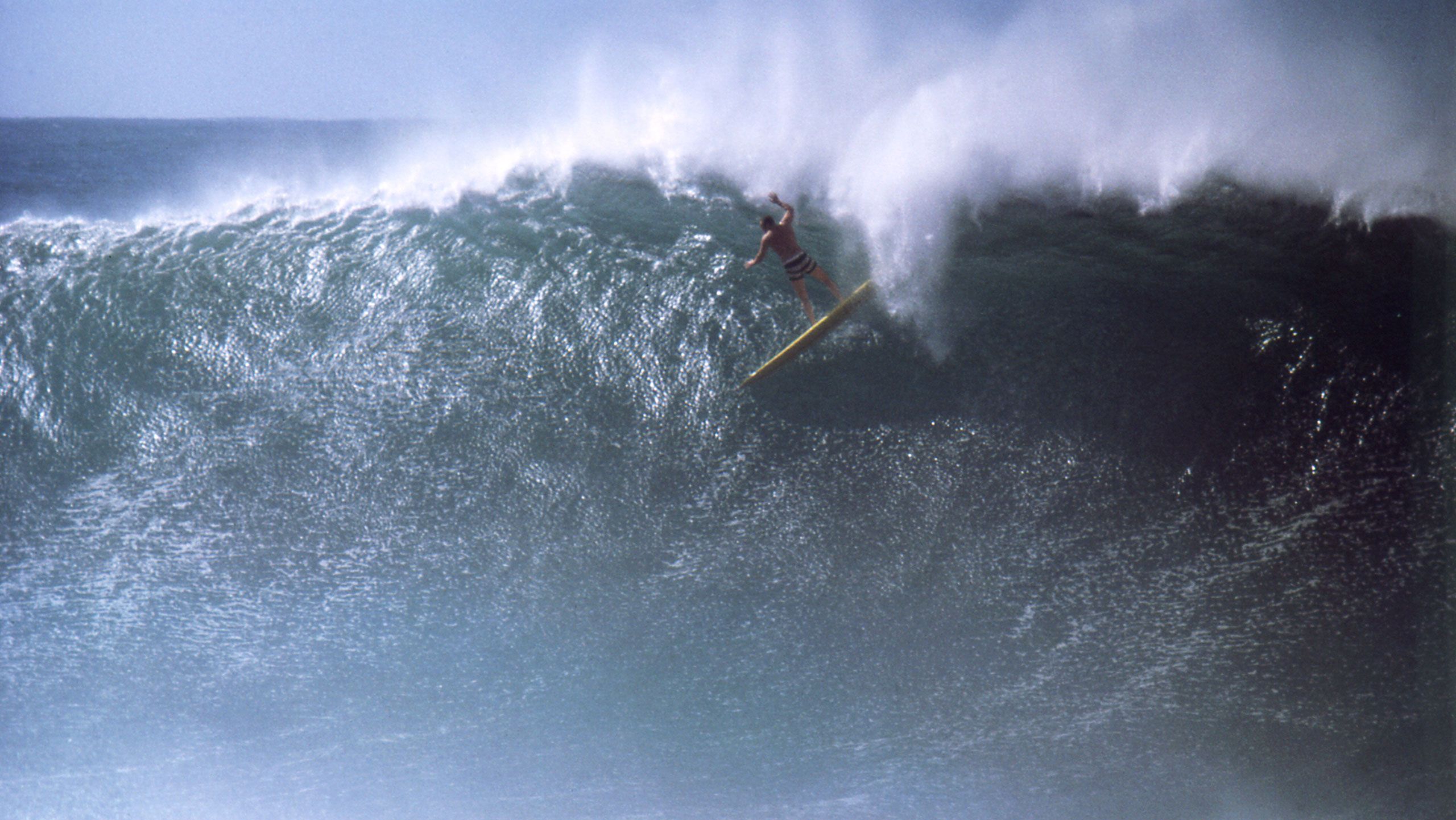An artwork by Greg Noll surfing at Waimea Bay, dated 1963.