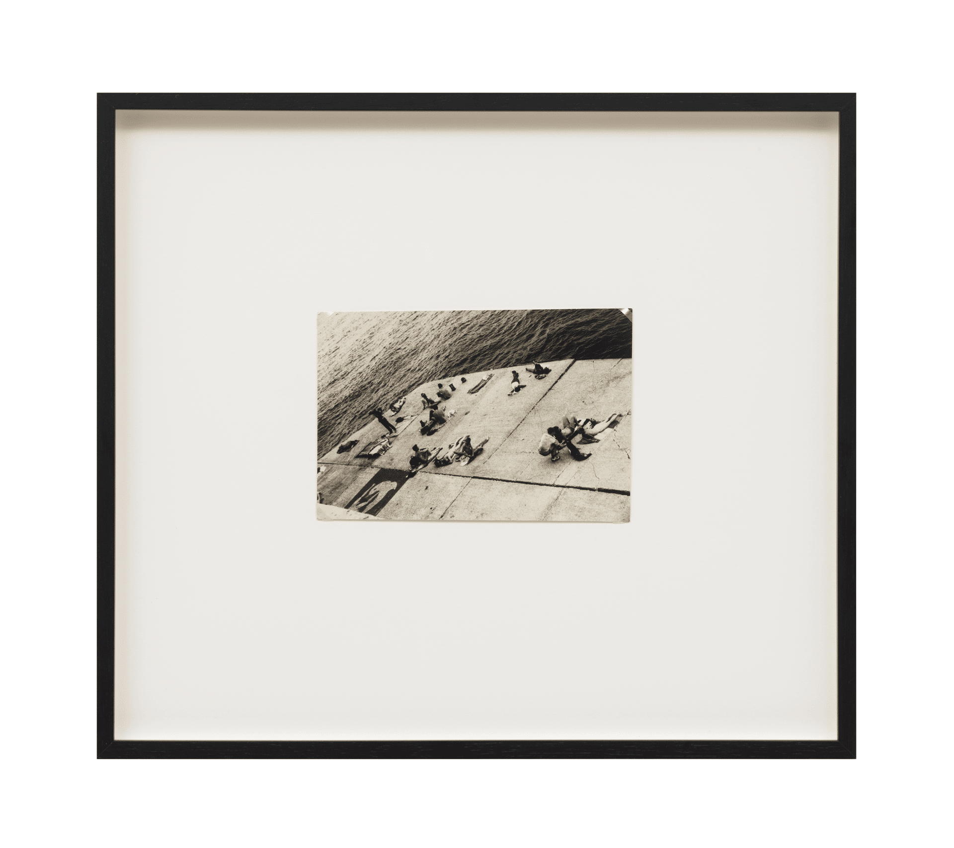 A photograph by Alvin Baltrop, titled The Piers (sunbathing platform with Tava mural), dated 1975-1986.