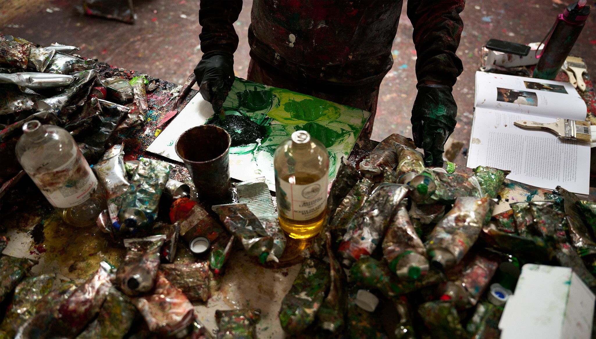 A photo of Dana Schutz in her studio, 2023. Photo by Jason Schmidt