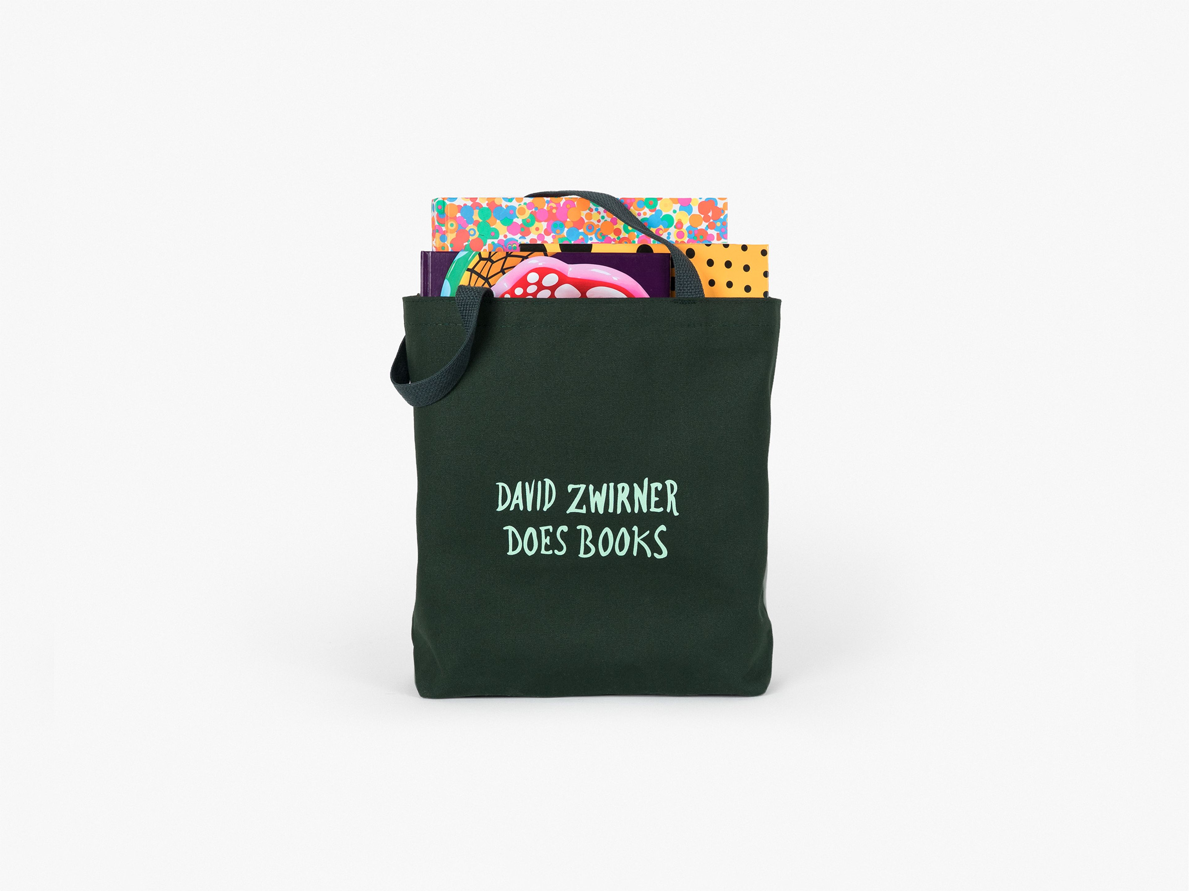 A heavy-duty cotton canvas tote in hunter green, featuring screenprinted handwriting by Marcel Dzama.