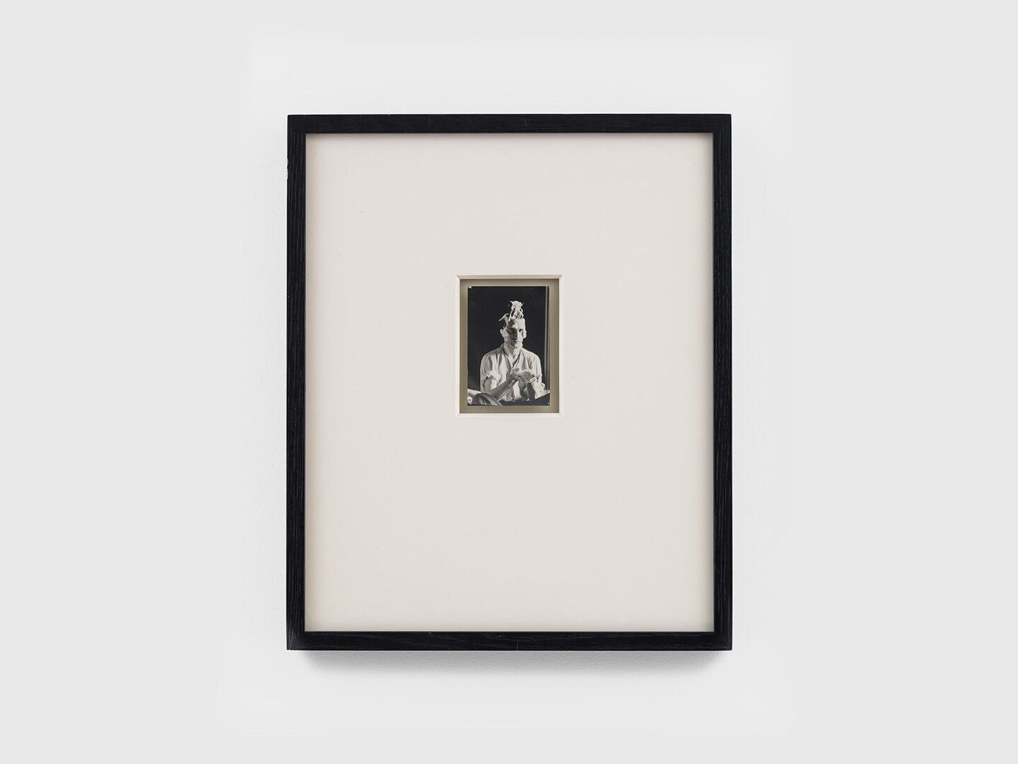A photograph by Man Ray, titled Marcel Duchamp photographi√© pour Obligation pour la roulette de Monte Carlo, translated as Marcel Duchamp photographed for the Monte Carlo Bond, dated 1924.