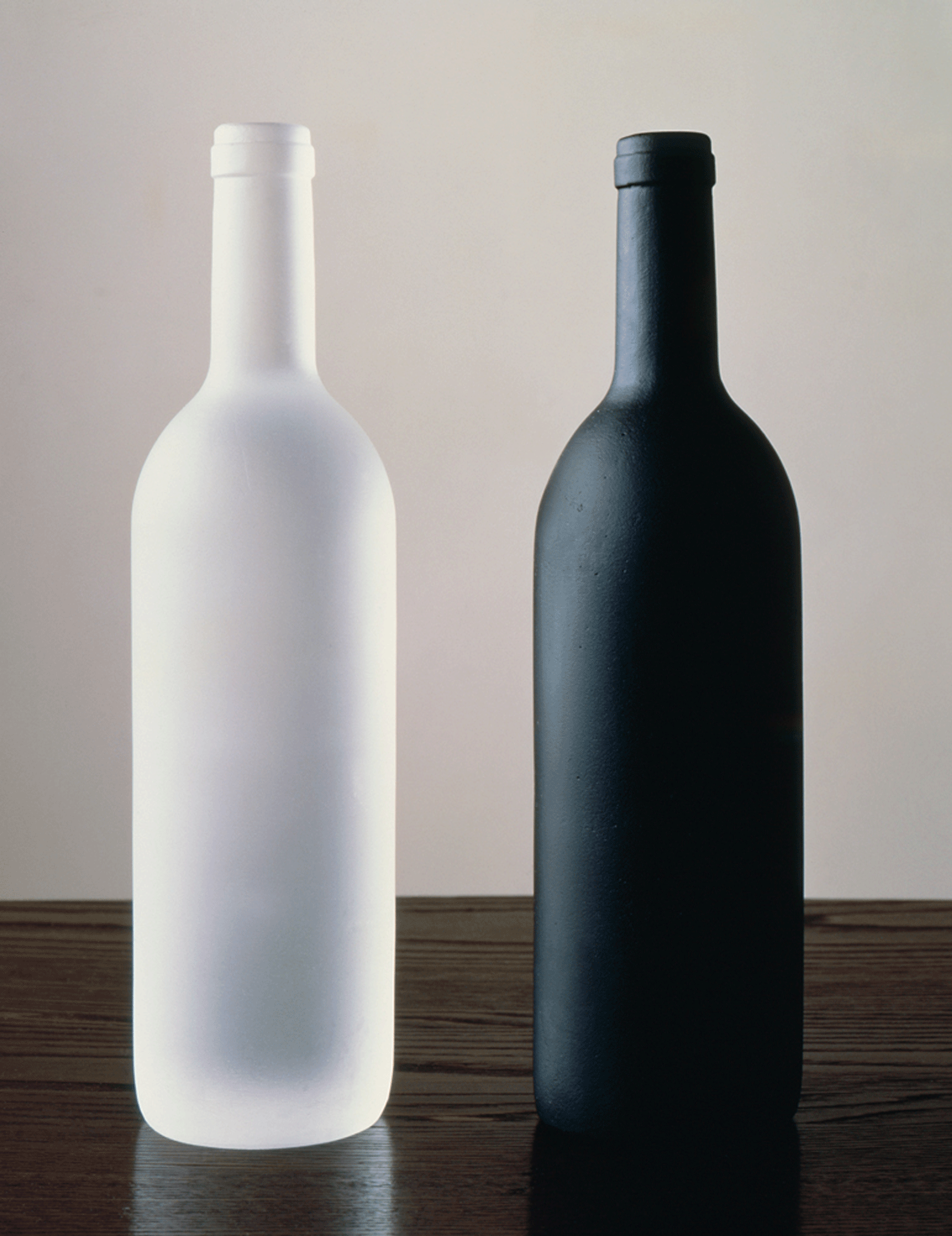 A sculpture by Sherrie Levine, titled, Black and White Bottles, dated 1992.