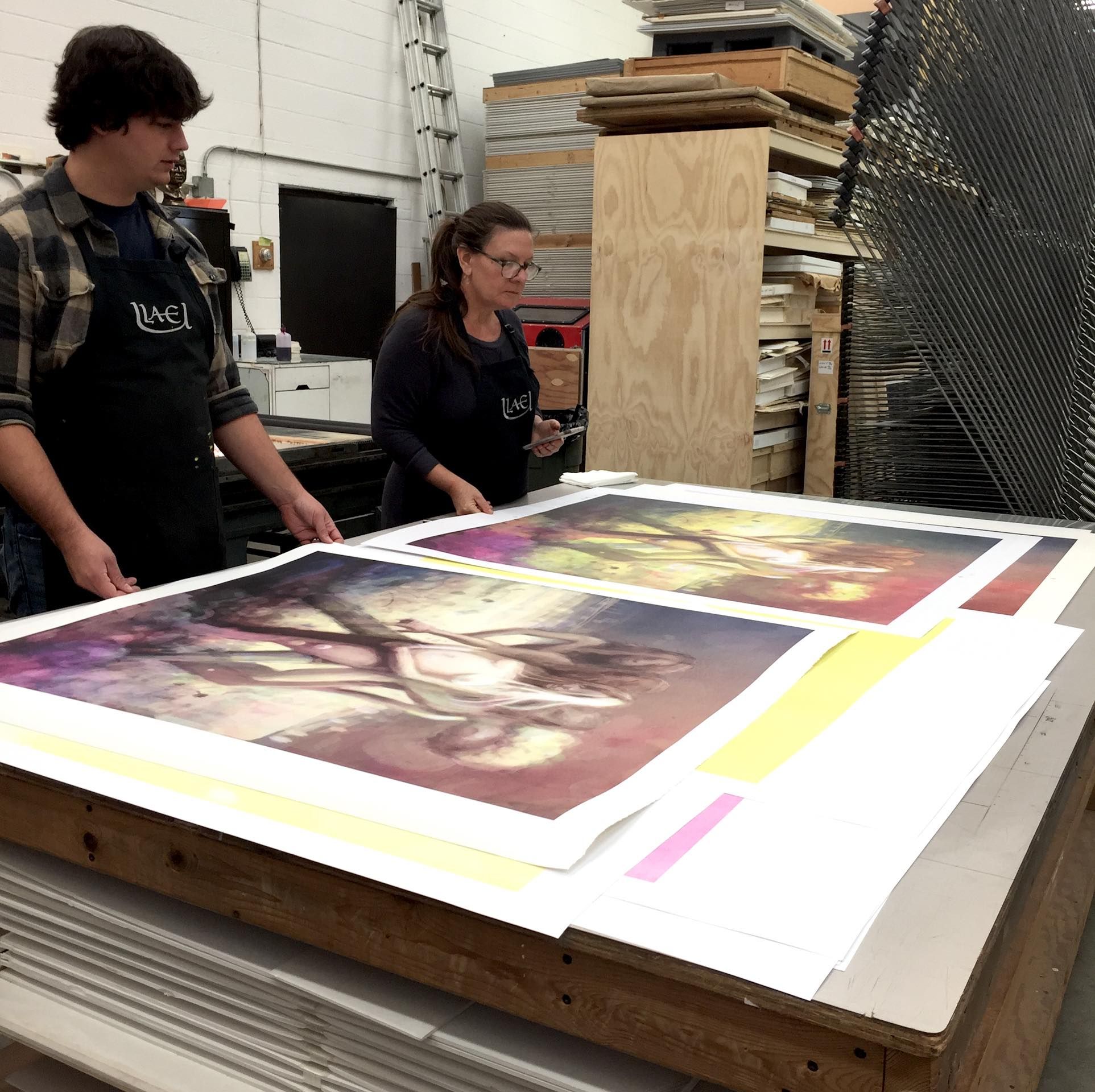 A photo of artworks at the printer.