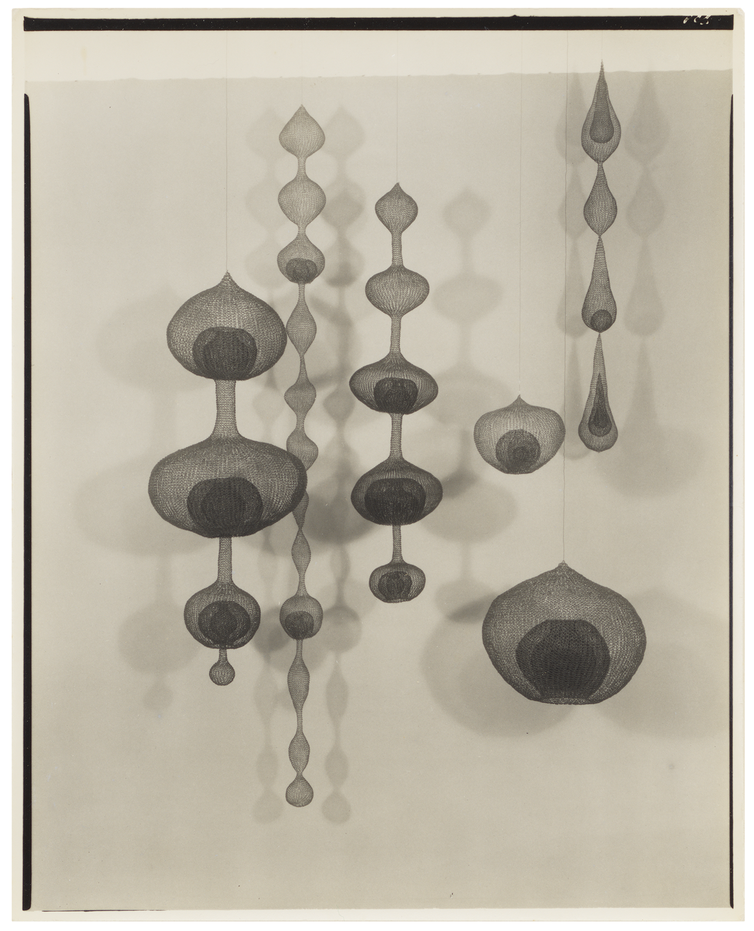 A photograph by Imogen Cunningham, titled Ruth Asawa's Wire Baskets and Their Shadows, dated 1956.