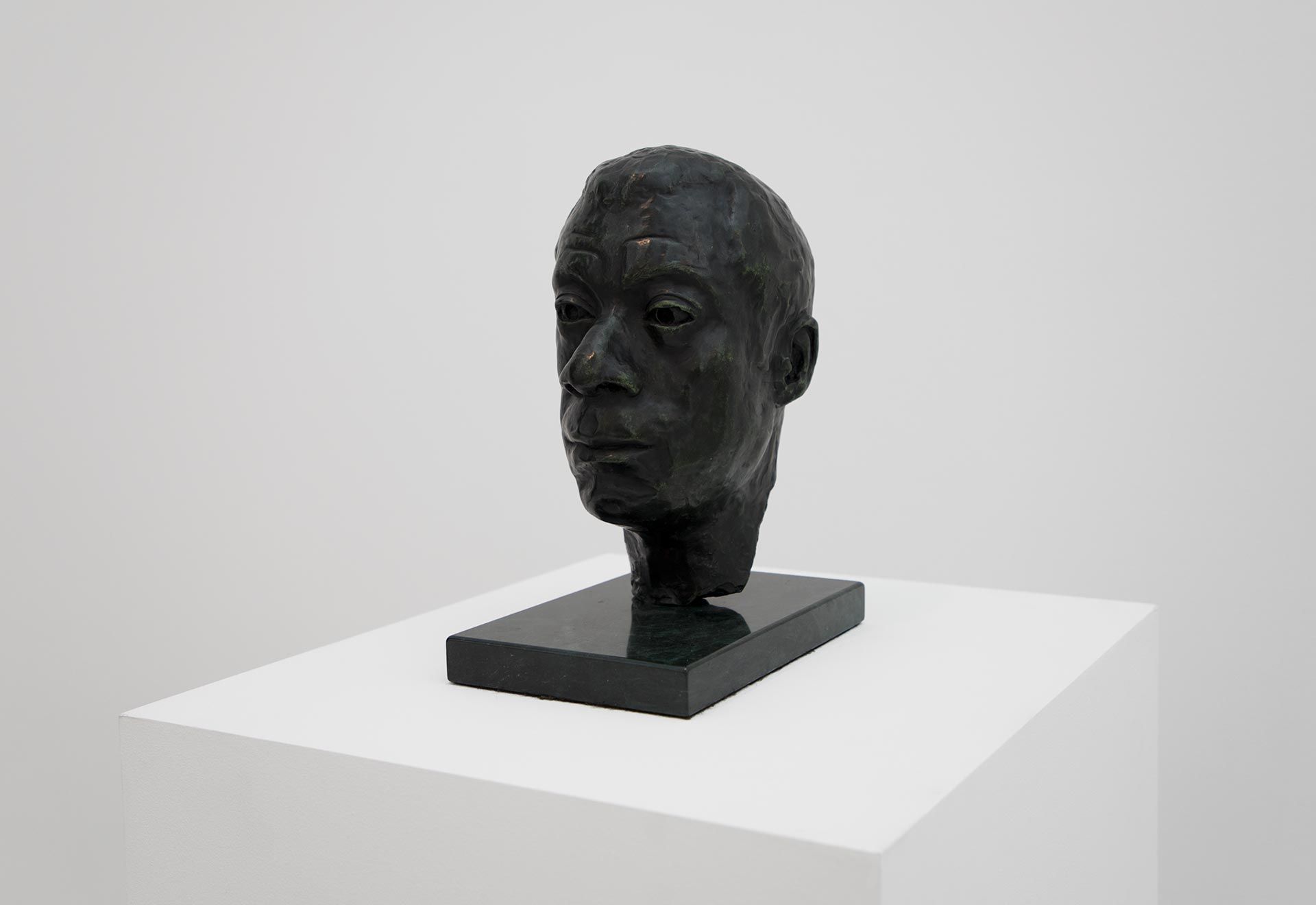 A sculpture by Larry Wolhandler, titled Bust of James Baldwin, dated 1975.