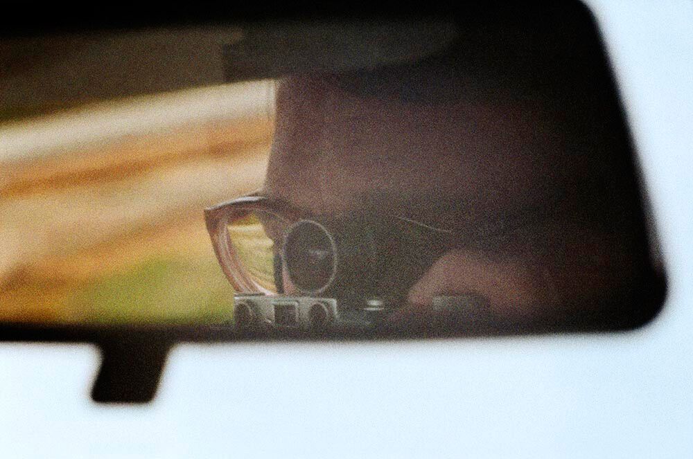 A self-portrait photo by William Eggleston, dated c.1983-1986.