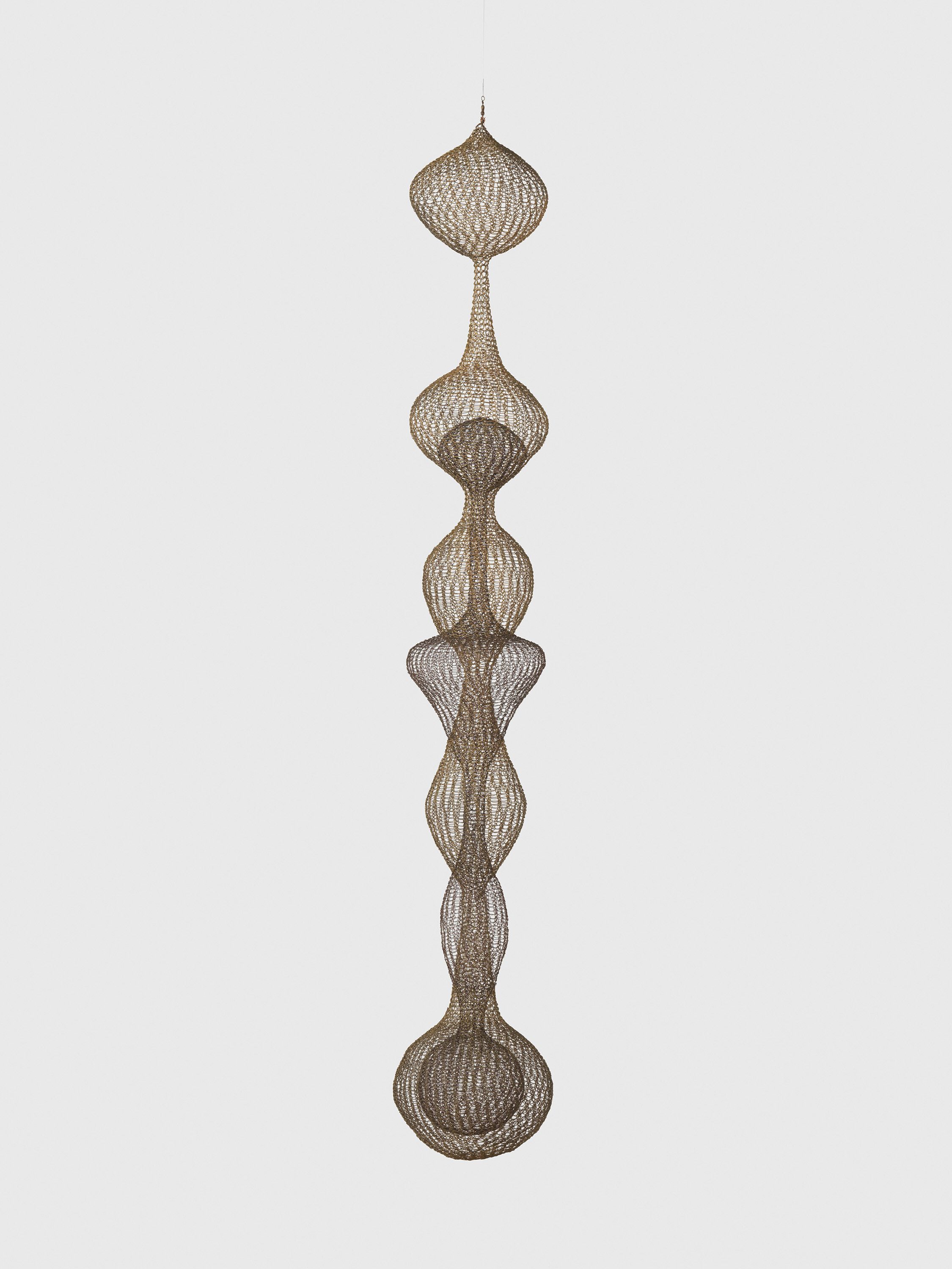 A hanging sculpture—brass and steel wire artwork by Ruth Asawa, titled Untitled (S.643, Hanging Seven-Lobed, Multilayered Interlocking Continuous Form), dated circa 1956.