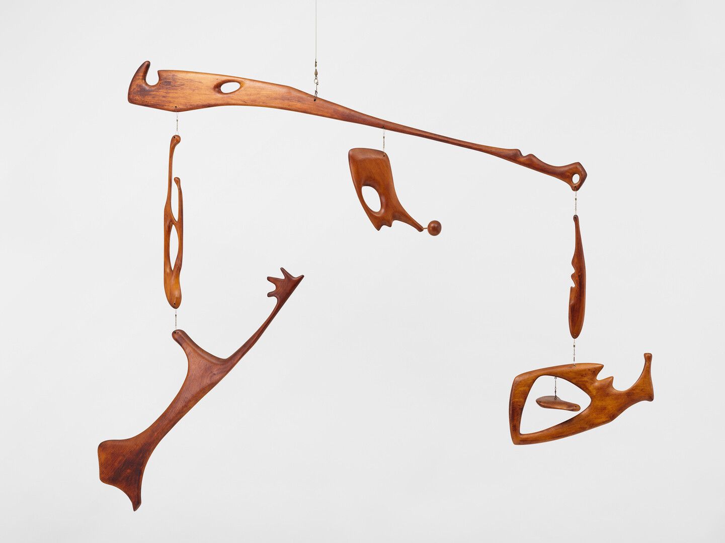 A hanging wood and wire mobile sculpture by Leo Amino, titled, Trinity, dated 1948.